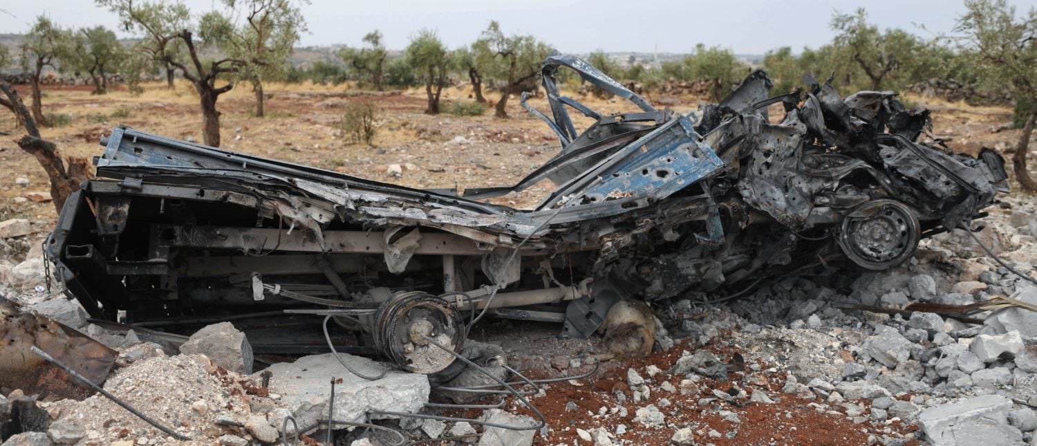 A picture taken on October 28, 2019 shows a vehicle wreck amid the rubble at the site of a suspected US-led operation against Islamic State (IS) chief Abu Bakr al-Baghdadi the previous day, on the edge of the small Syrian village of Barisha in the country's opposition-held northwestern Idlib province. - US President Donald Trump announced that Baghdadi, the elusive leader of the jihadist group and the world's most wanted man, was killed in the early hours of Octobe 27 in an overnight US raid near the village, located less than five kilometres from Turkey and controlled by the dominant jihadist group Hayat Tahrir al-Sham, an organisation that includes former operatives from Al-Qaeda's Syria affiliate. (Photo by Omar HAJ KADOUR / AFP) (Photo by OMAR HAJ KADOUR/AFP via Getty Images)