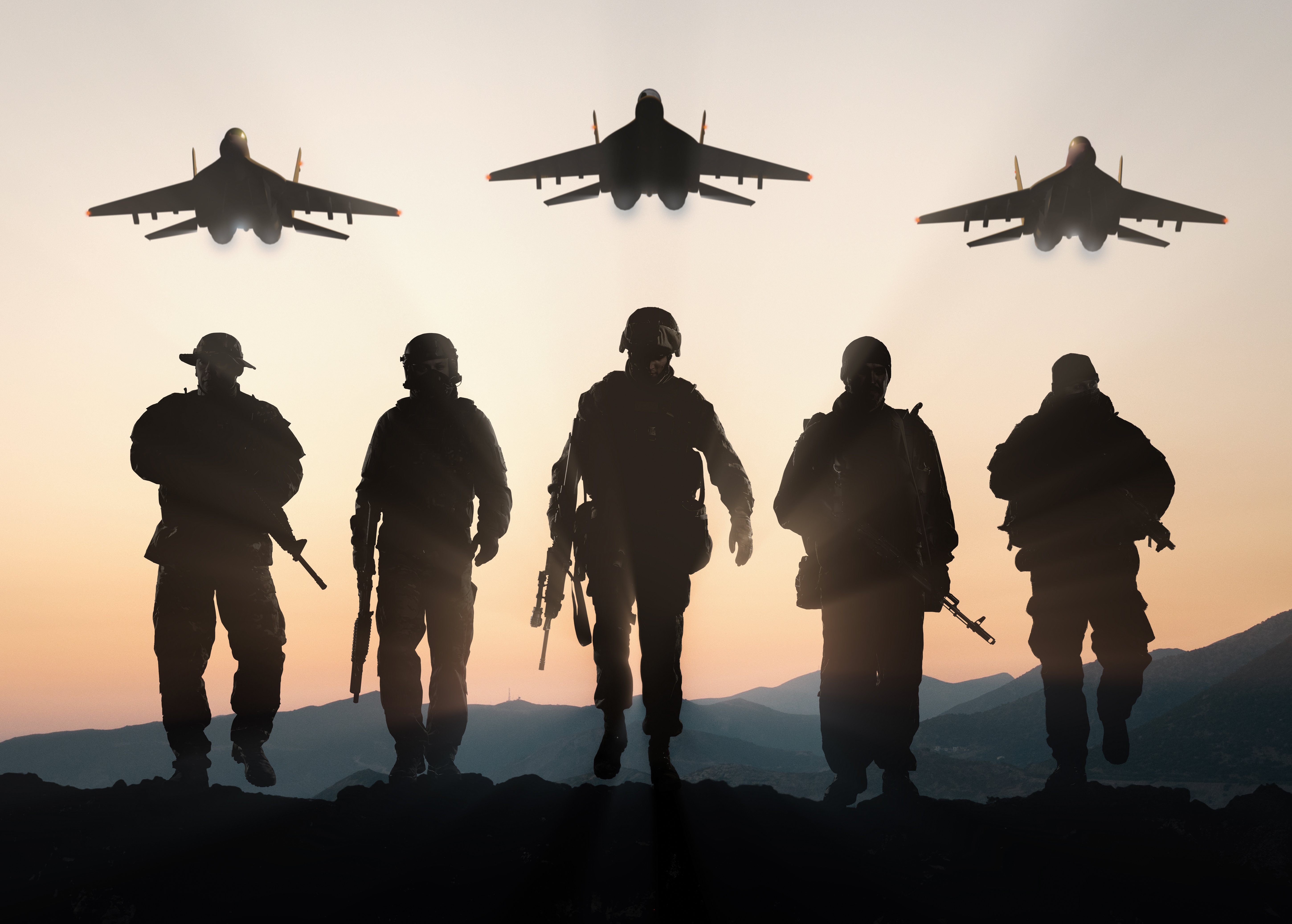 shutterstock- Military silhouettes of soldiers and airforce against the backdrop of sunset sky.