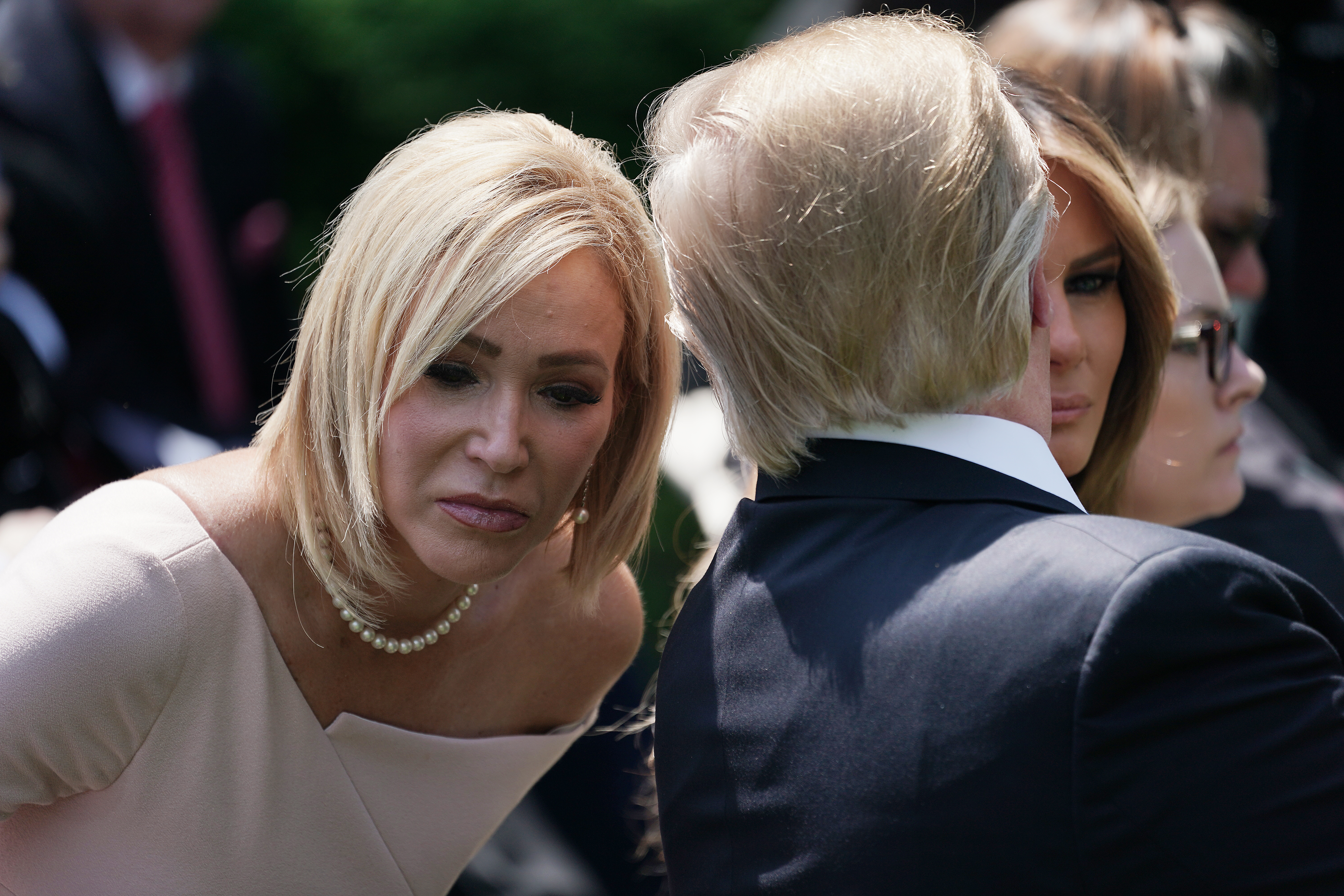 WASHINGTON, DC - MAY 02: U.S. President Donald Trump (R) speaks to Paula White, chair of the White House evangelical advisory board, during a National Day of Prayer service in the Rose Garden at the White House May 02, 2019 in Washington, DC. The White House invited leaders from various faiths and religions to participate in the day of prayer, which was designated in 1952 by the United States Congress to ask people "to turn to God in prayer and meditation." (Photo by Chip Somodevilla/Getty Images)