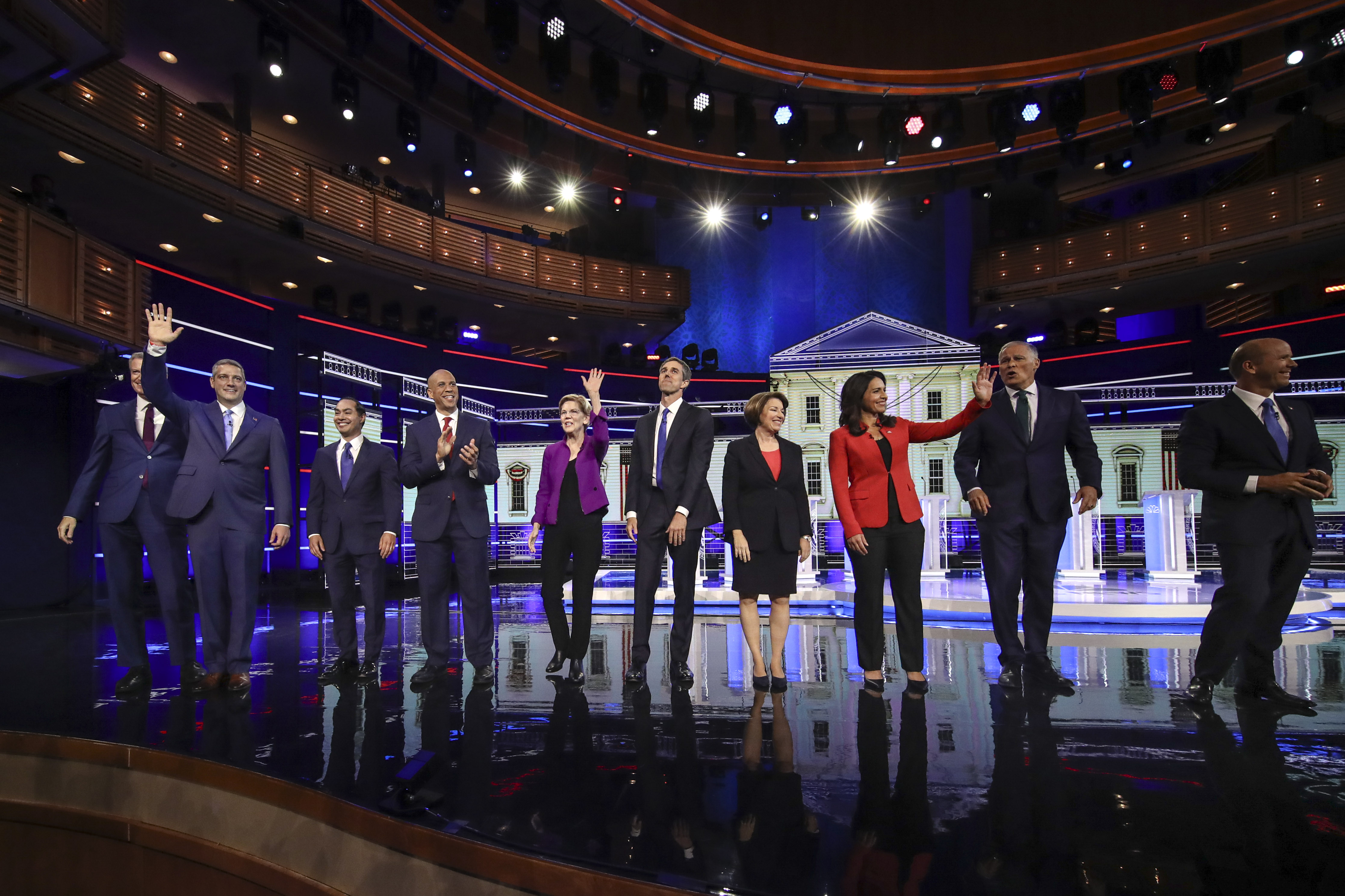 (L-R) Democratic presidential candidates New York City Mayor Bill de Blasio (L-R), Rep. Tim Ryan, former Housing Secretary Julian Castro, Sen. Cory Booker, Sen. Elizabeth Warren, former Texas Rep. Beto O'Rourke, Sen. Amy Klobuchar, Rep. Tulsi Gabbard, Washington Gov. Jay Inslee, and former Maryland Rep. John Delaney take the stage for the first Democratic presidential primary debate for the 2020 election at the Adrienne Arsht Center for the Performing Arts, June 26, 2019 in Miami, Florida. (Photo by Drew Angerer/Getty Images)