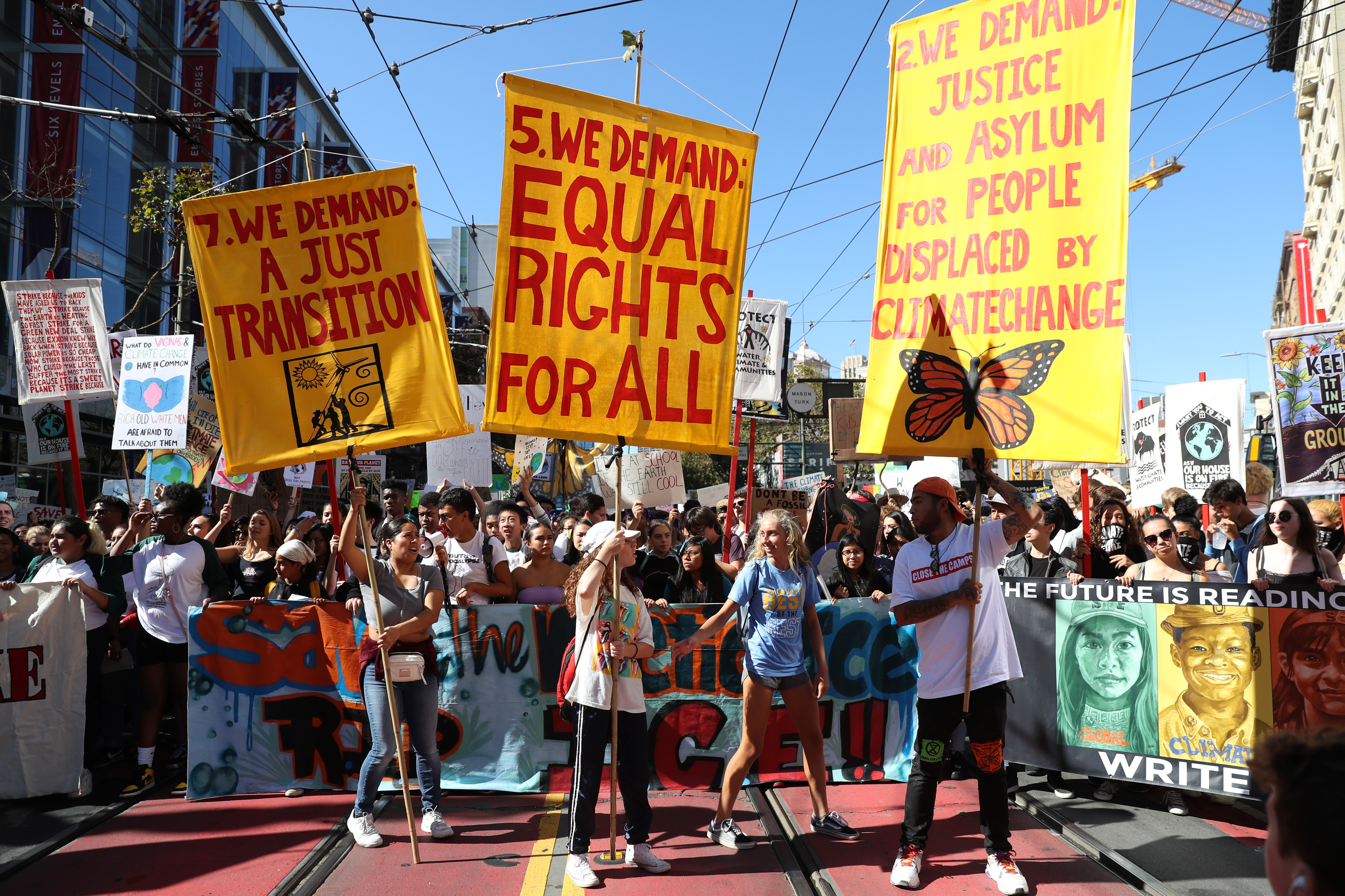 Young activists and their supporters hold signs as they march during a Global Climate Strike demonstration on September 20, 2019 in San Francisco, California. (Photo by Justin Sullivan/Getty Images)