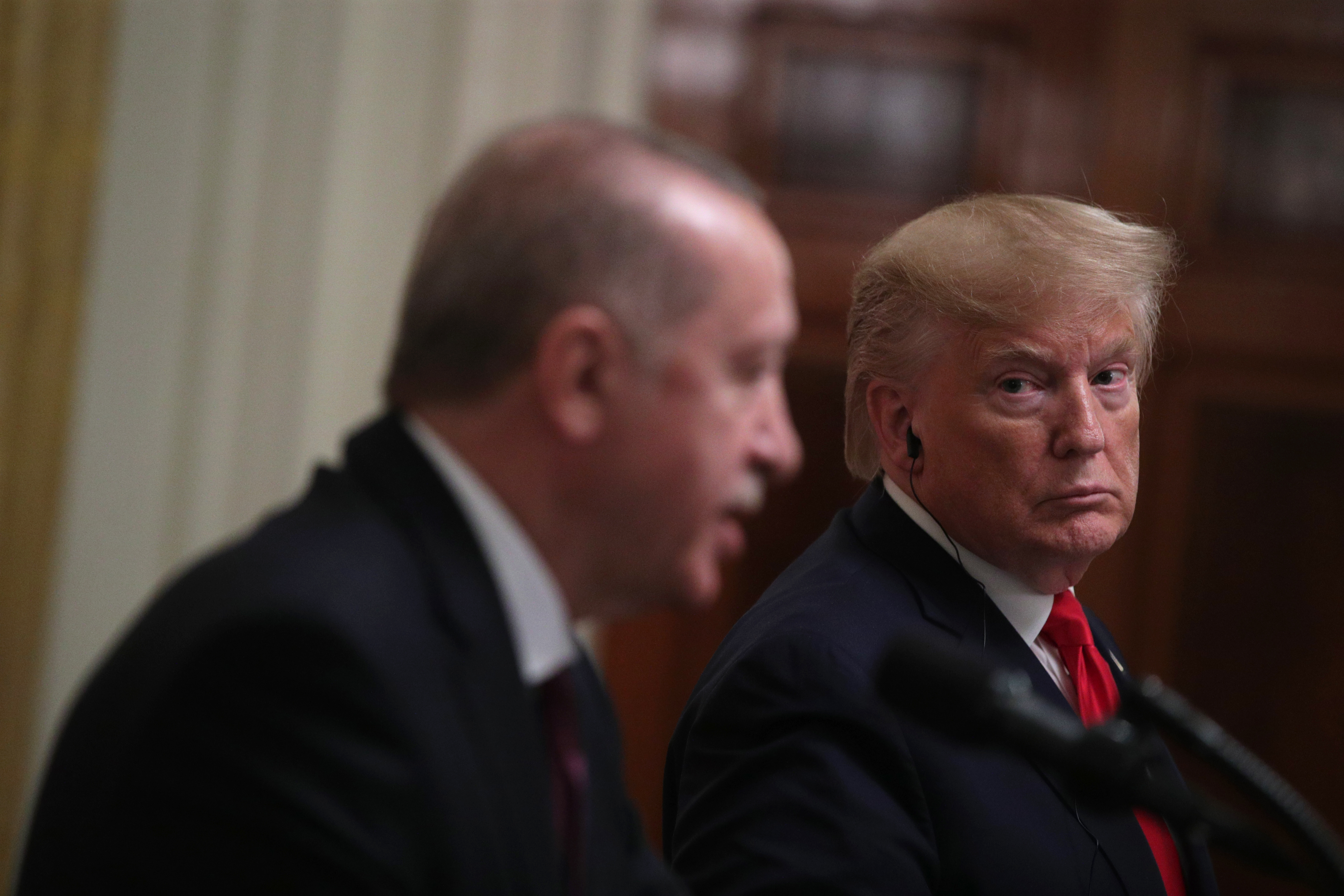 U.S. President Donald Trump listens as Turkish President Recep Tayyip Erdogan answers a question during a press conference in the East Room of the White House on November 13, 2019 in Washington, DC. (Photo by Alex Wong/Getty Images)