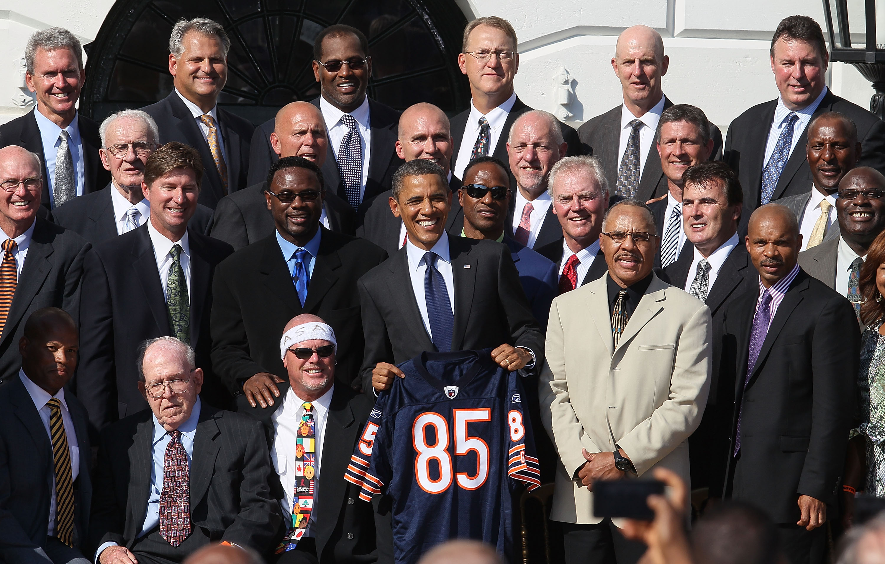 WASHINGTON, DC - OCTOBER 07: U.S. President Barack Obama stands with members of the the 1985 Super Bowl Champion Chicago Bears, during an event on the south lawn of the White House, on October 7, 2011 in Washington, DC. President Obama who is a Bears fan, realized the team never got to enjoy the customary ceremony given to the champions of the season, and invited the team to the White House. (Photo by Mark Wilson/Getty Images)