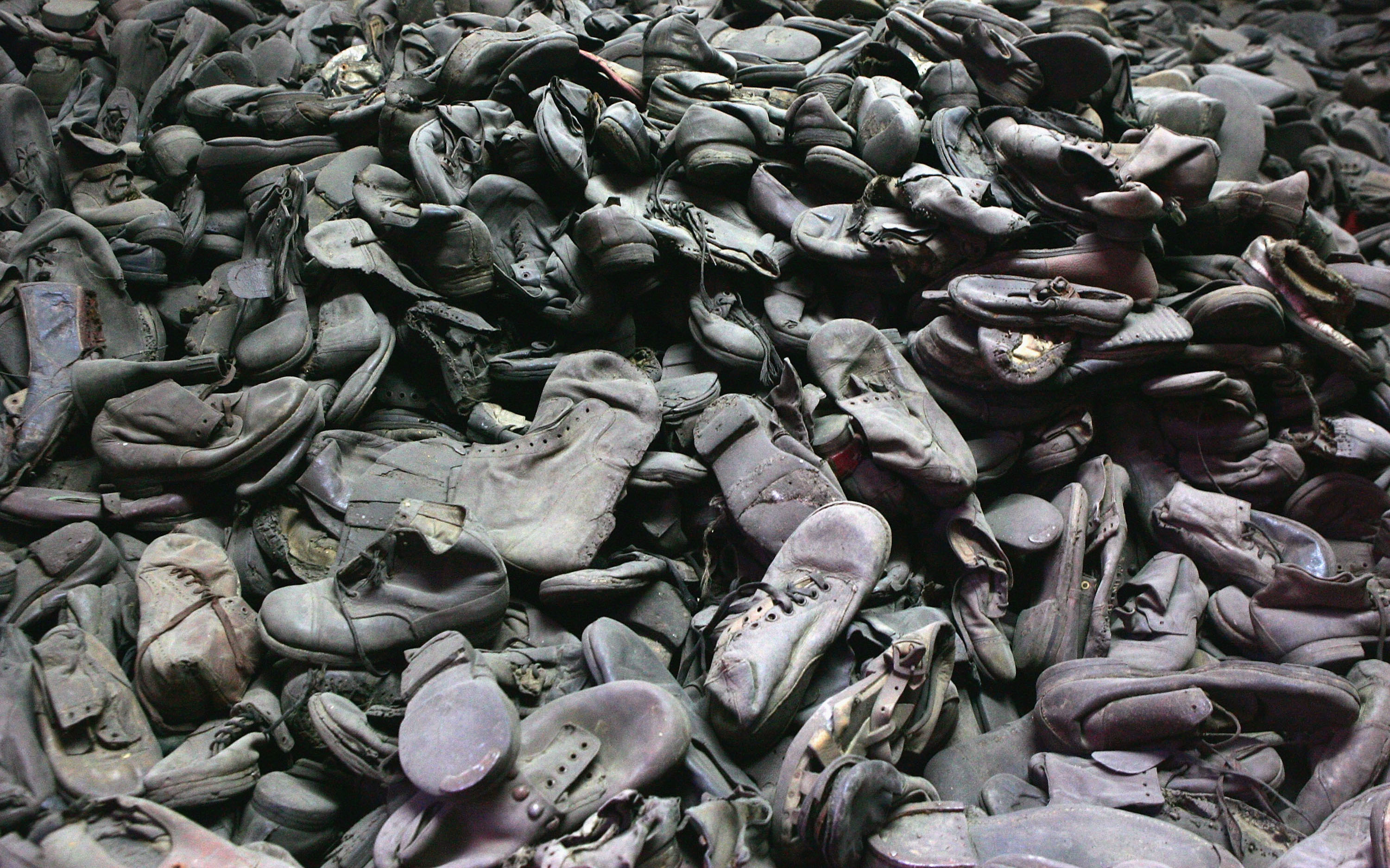 BREZEZINKA, POLAND - DECEMBER 8: A mass of footware removed from the men, women and children, taken December 8, 2004 is seen at the Auschwitz Concentration Camp Museum in Oswiecim, Poland. The camp was liberated by the Soviet army on January 27, 1945, January 2005 will be the 60th anniversary of the liberation of the extermination and concentration camps, when survivors and victims who suffered as a result of the Holocaust will commemorated across the world. (Photo by Scott Barbour/Getty Images)
