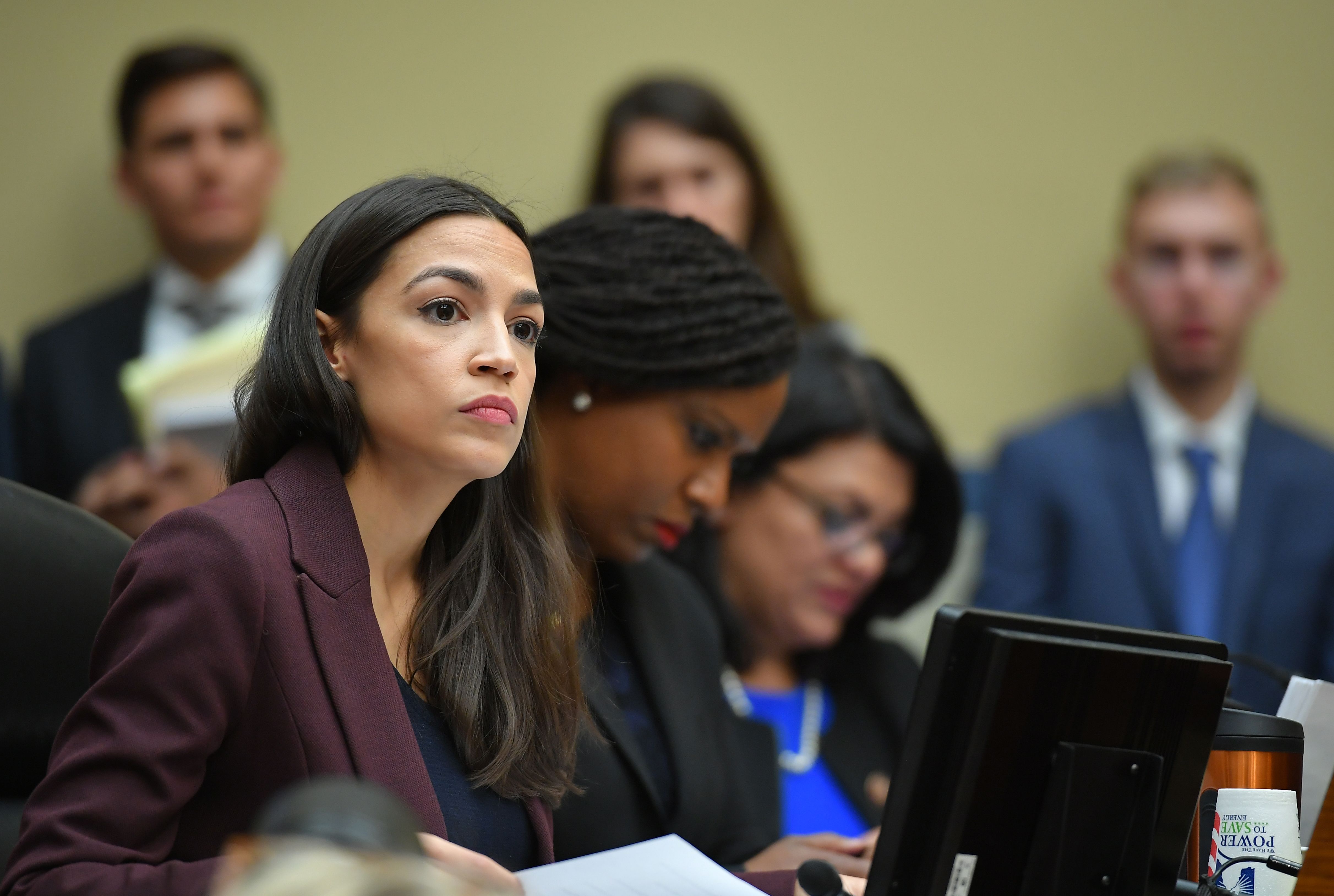 U.S. Rep. Alexandria Ocasio-Cortez(D-NY) listens as Michael Cohen testifies before the House Oversight and Reform Committee on February 27, 2019. (Mandel Ngan/AFP/Getty Images)
