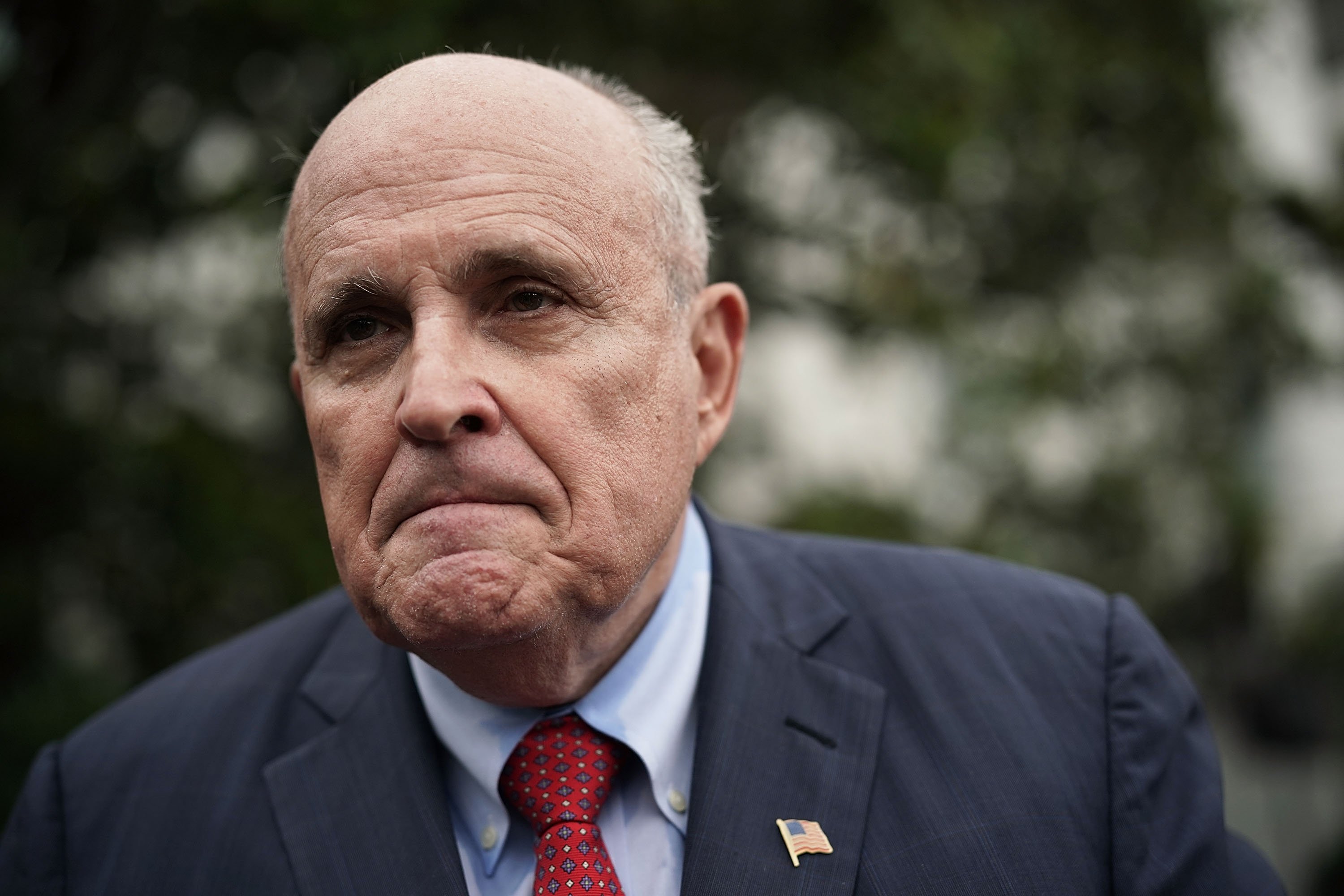 Rudy Giuliani, former New York City mayor and current lawyer for U.S. President Donald Trump, speaks to members of the media during a White House Sports and Fitness Day at the South Lawn of the White House May 30, 2018 in Washington, DC. President Trump hosted the event to encourage children to participate in sports and make youth sports more accessible to economically disadvantaged students. (Photo by Alex Wong/Getty Images)