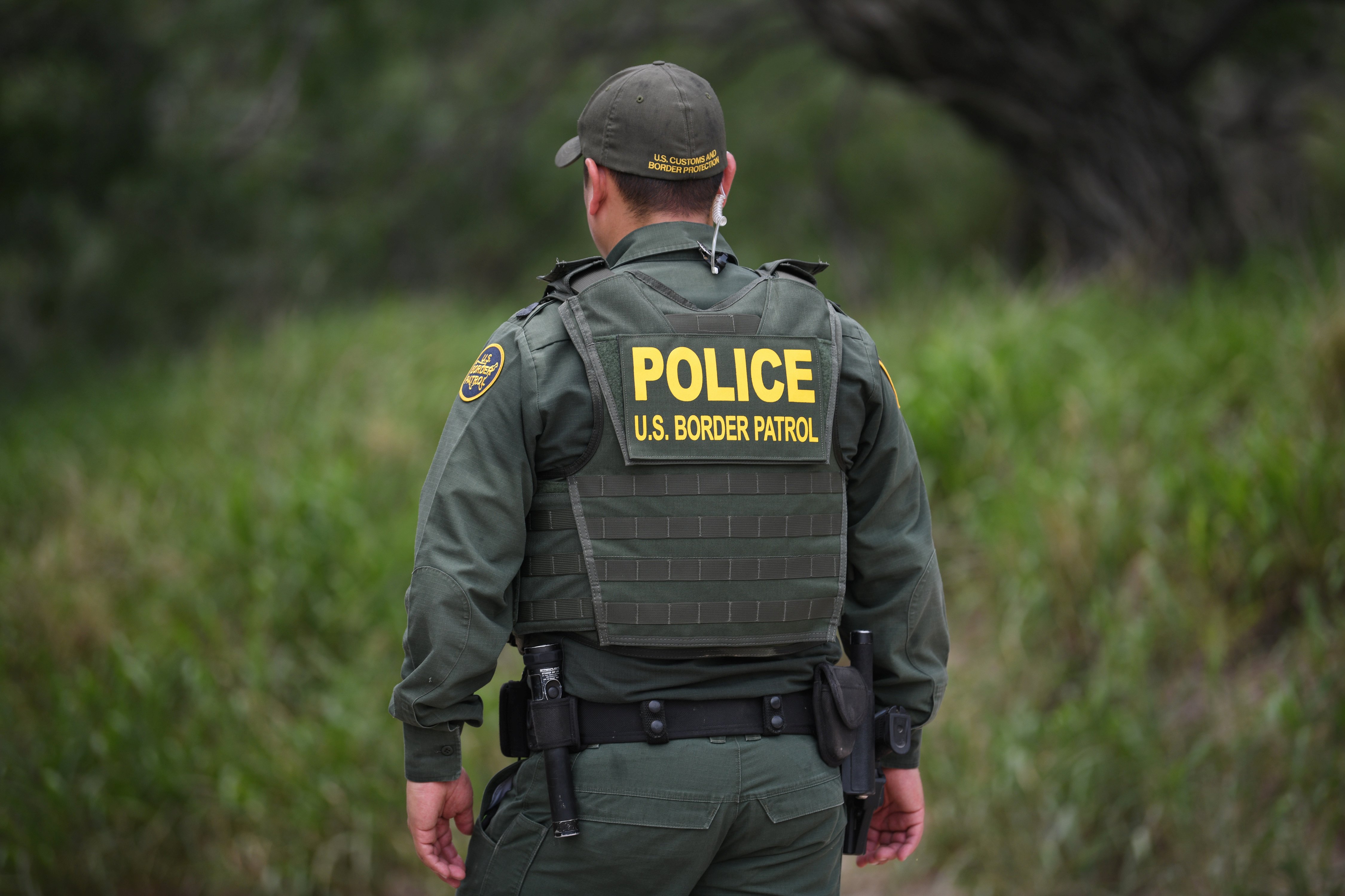 A U.S. Border Patrol agent is seen at the U.S.-Mexico border in Mission