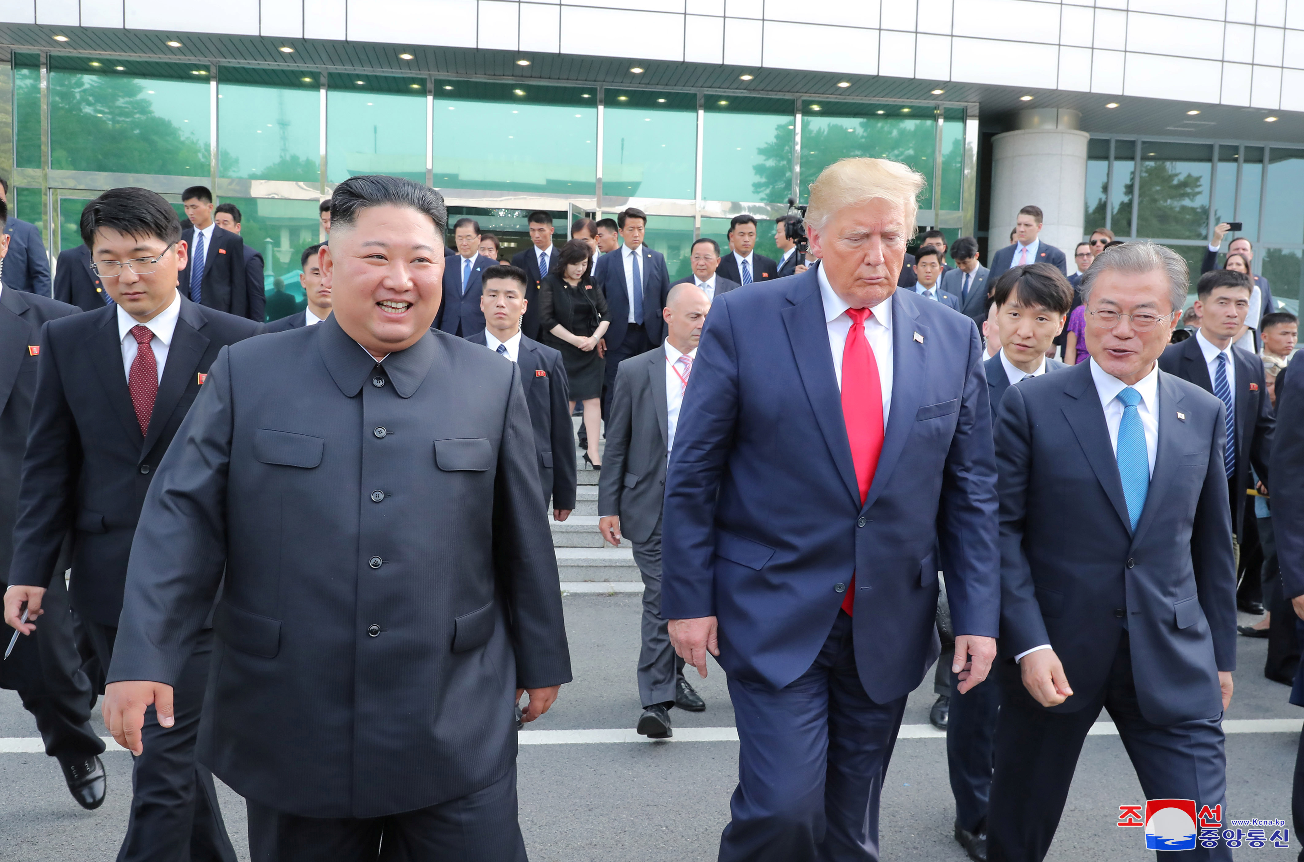 U.S. President Donald Trump, North Korean leader Kim Jong Un and South Korea's President Moon Jae-in meet at the demilitarized zone (DMZ) separating the two Koreas, in Panmunjom, South Korea, June 30, 2019. KCNA via REUTERS