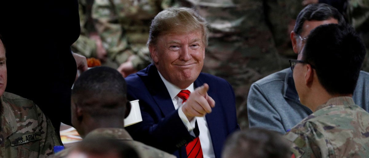 U.S. President Donald Trump eats dinner with U.S. troops at a Thanksgiving dinner event during a surprise visit at Bagram Air Base in Afghanistan, Nov. 28, 2019. REUTERS/Tom Brenner