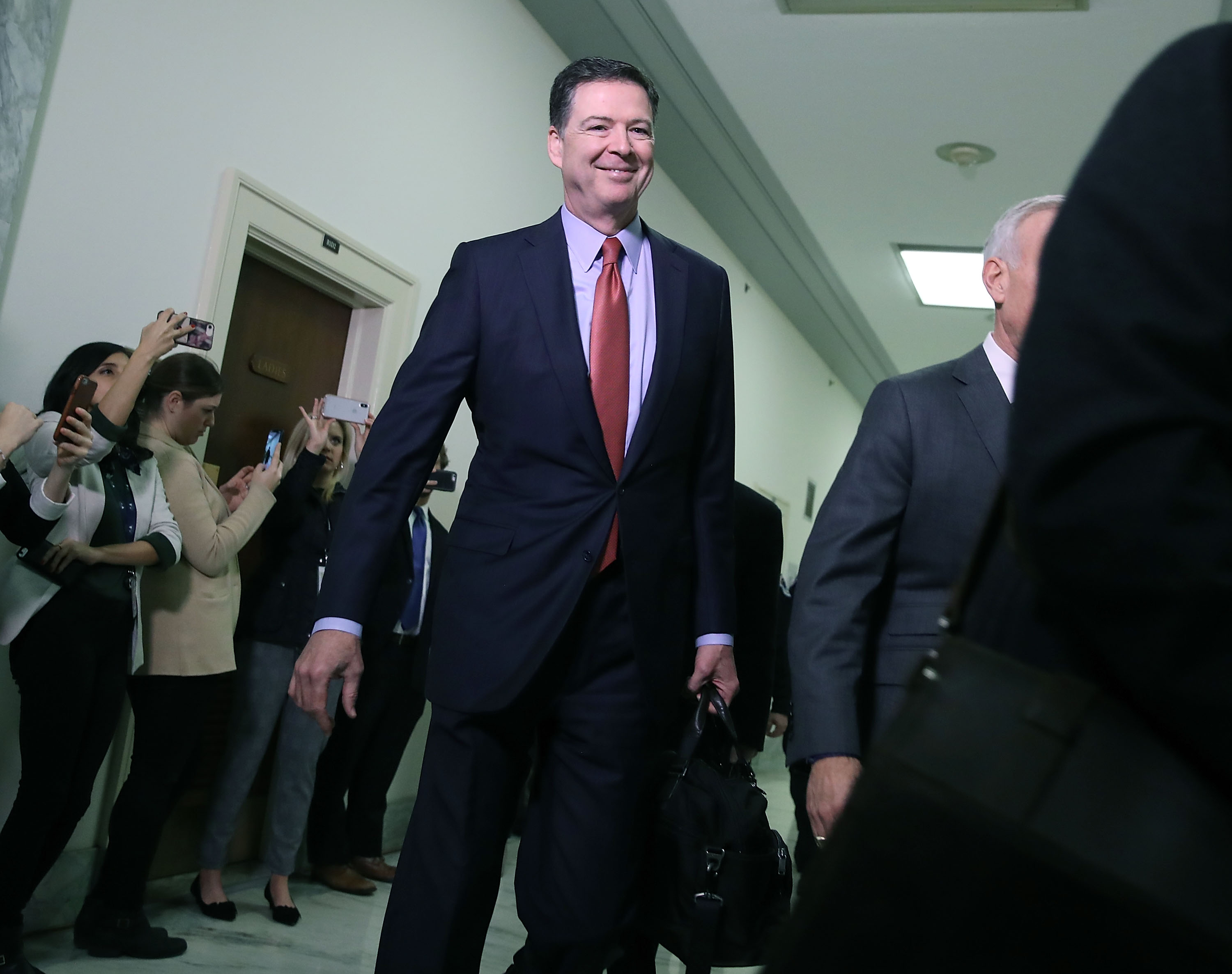 WASHINGTON, DC - DECEMBER 17: Former Federal Bureau of Investigation Director James Comey arrives at the Rayburn House Office Building before testifying to the House Judiciary and Oversight and Government Reform committees on Capitol Hill December 17, 2018 in Washington, DC. House Republicans subpoenaed Comey to testify behind closed doors for a second time about investigations into Hillary Clinton's email server and whether President Trump's campaign advisers colluded with the Russian government to steer the outcome of the 2016 presidential election. (Photo by Mark Wilson/Getty Images)
