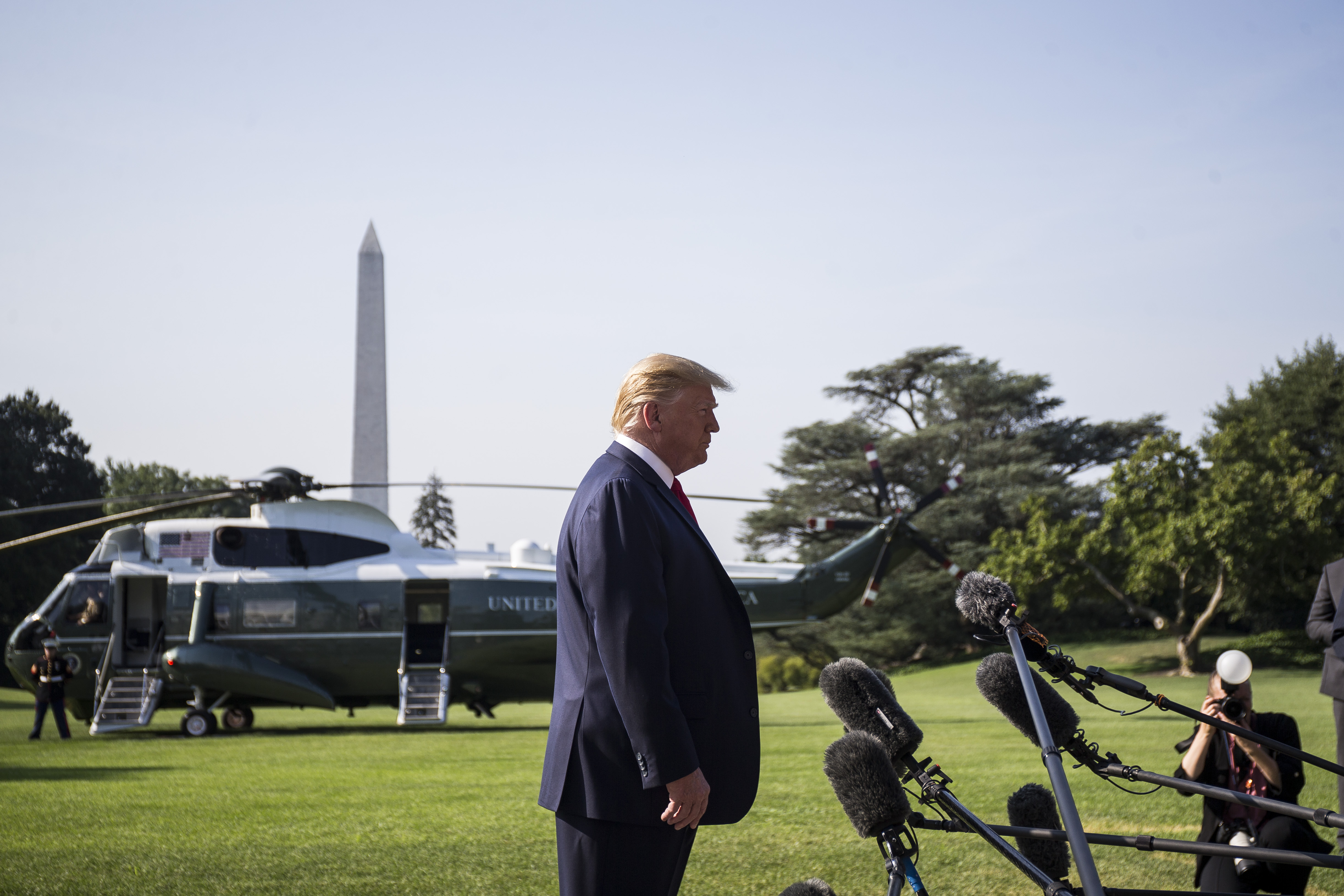 President Donald Trump speaks to members of the press before departing from the White House en route to Dayton, Ohio and El Paso, Texas on August 7, 2019 in Washington, DC. (Zach Gibson/Getty Images)