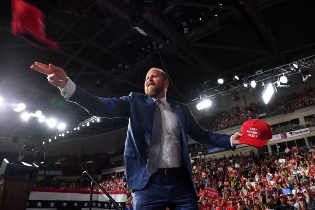 Brad Parscale, campaign manager for US President Donald Trump, thows caps to the audience during a "Keep America Great" campaign rally at the SNHU Arena in Manchester, New Hampshire, on August 15, 2019. (Photo by NICHOLAS KAMM/AFP via Getty Images)