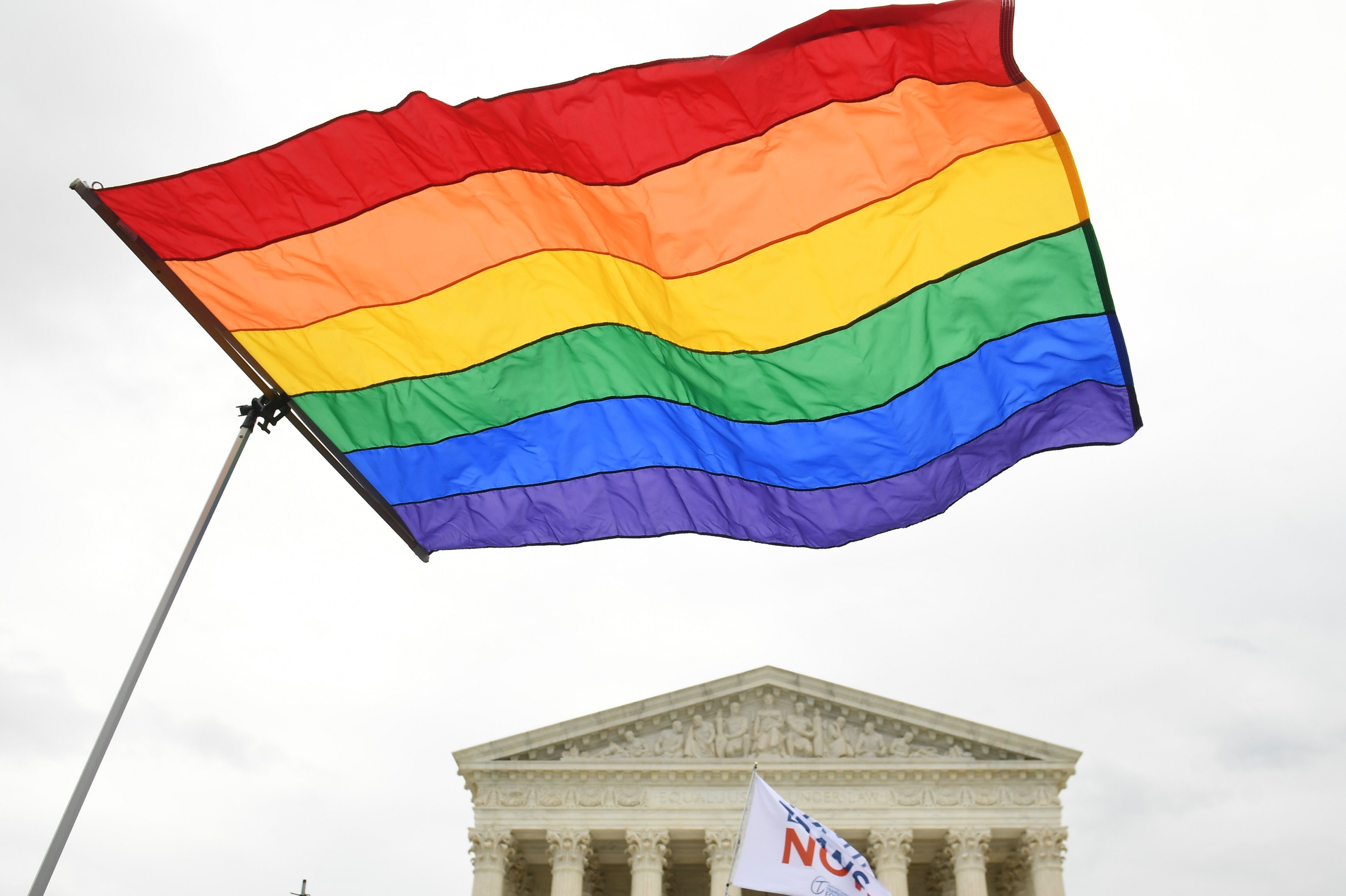 Demonstrators in favour of LGBT rights rally outside the US Supreme Court in Washington, DC, October 8, 2019, as the Court holds oral arguments in three cases dealing with workplace discrimination based on sexual orientation. (Photo by SAUL LOEB / AFP) (Photo by SAUL LOEB/AFP via Getty Images)