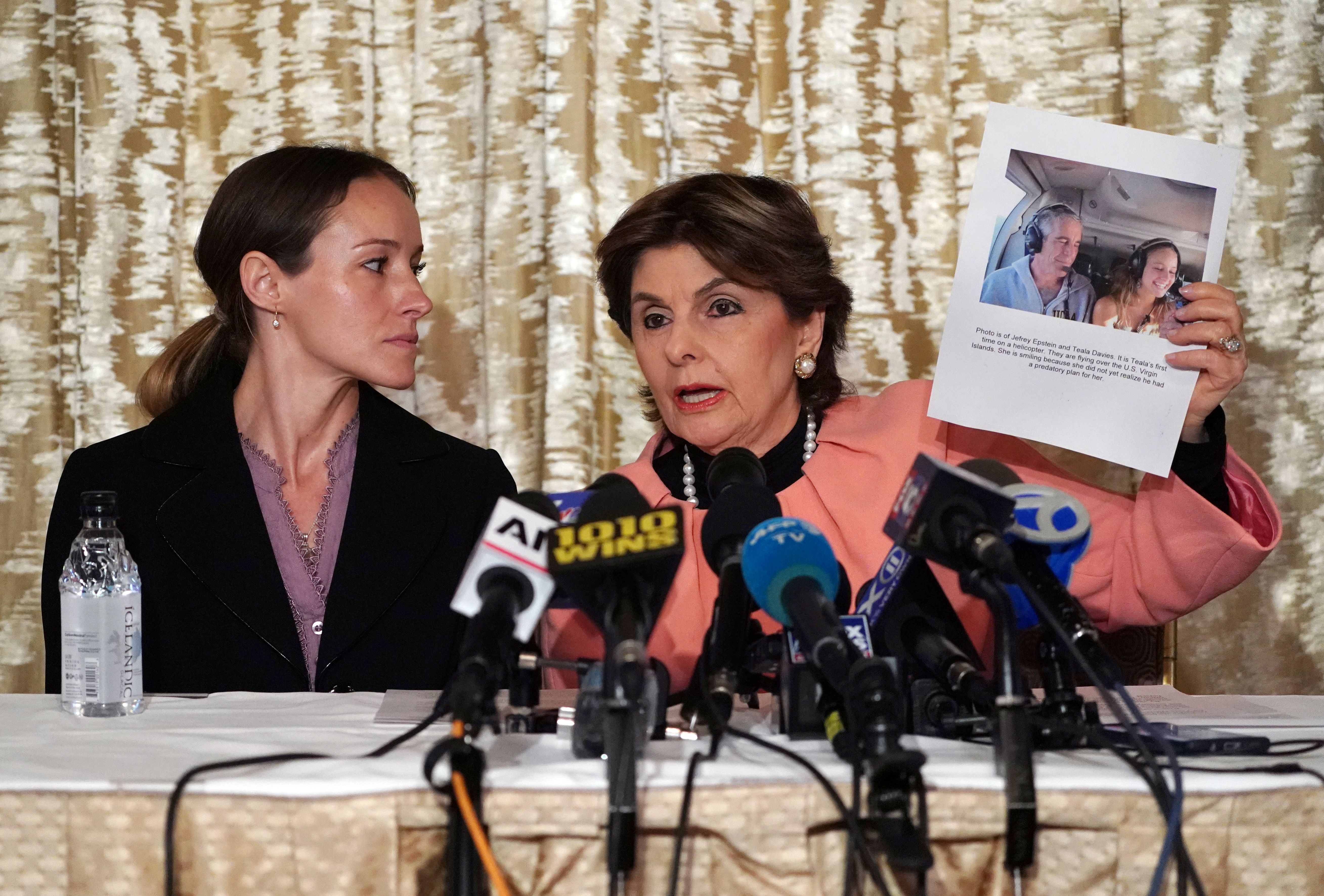 Attorney Gloria Allred (R) and her client Teala Davies, who claims to be a victim of sexual abuse by Jeffrey Epstein when she was a minor, hold a press conference in New York City on November 21, 2019. (TIMOTHY A. CLARY/AFP via Getty Images)