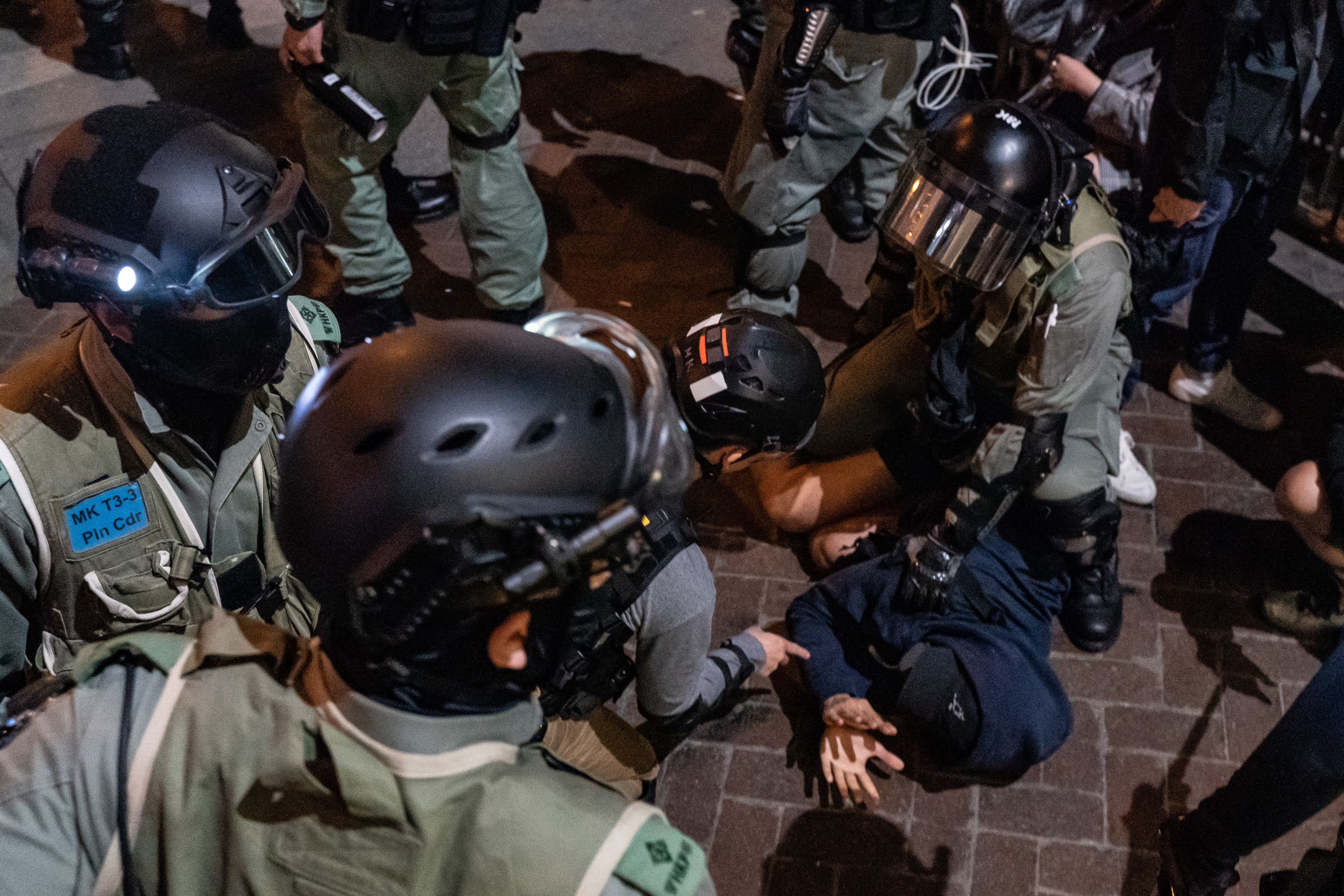 A man is detained by riot police outside of a police station at Mongkok district ahead of countdown on New Year's eve on December 31, 2019 in Hong Kong, China. (Anthony Kwan/Getty Images)