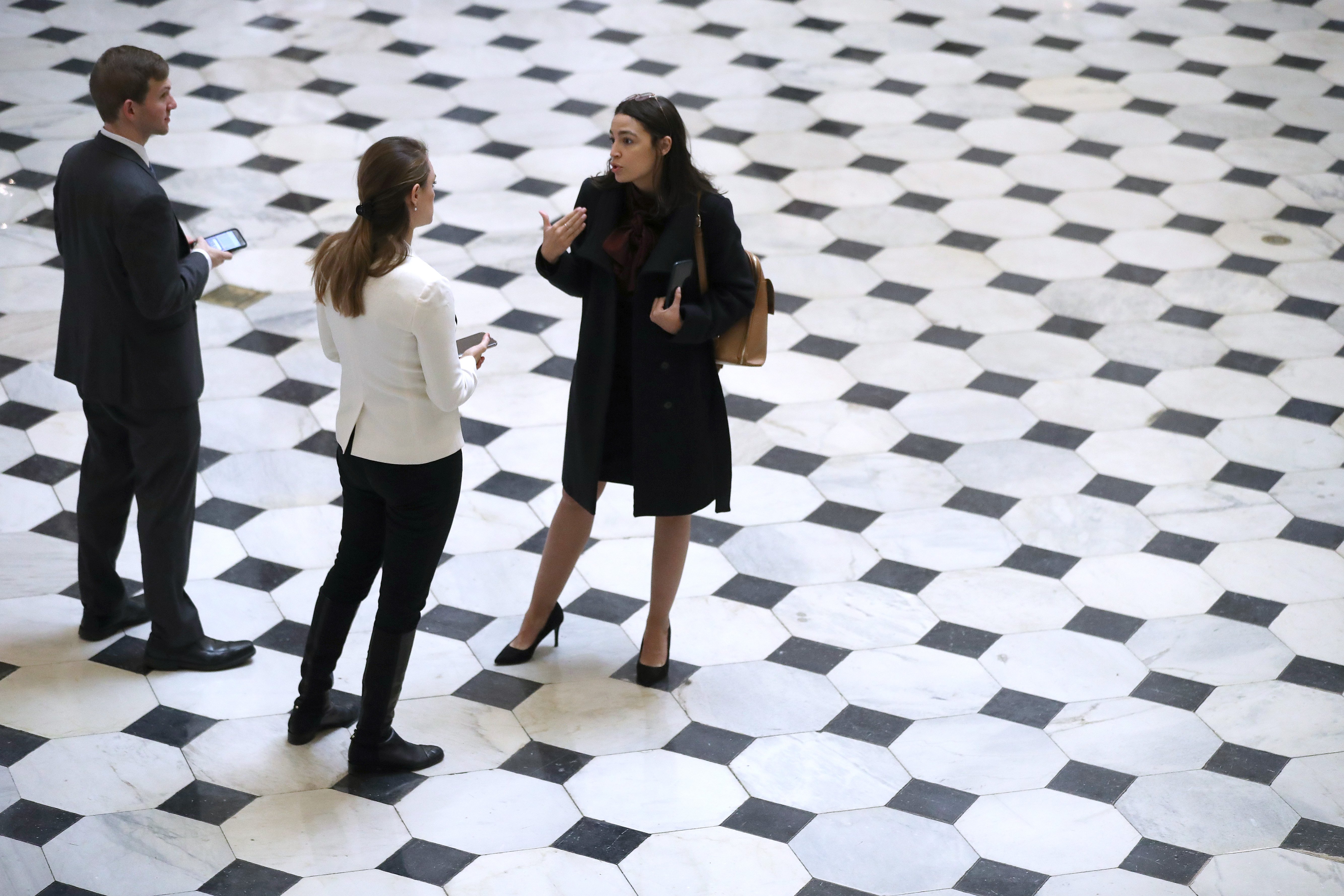 Rep. Alexandria Ocasio-Cortez talks with reporters in Statuary Hall in between votes at the U.S. Capitol December 18, 2019 in Washington, DC. (Chip Somodevilla/Getty Images)