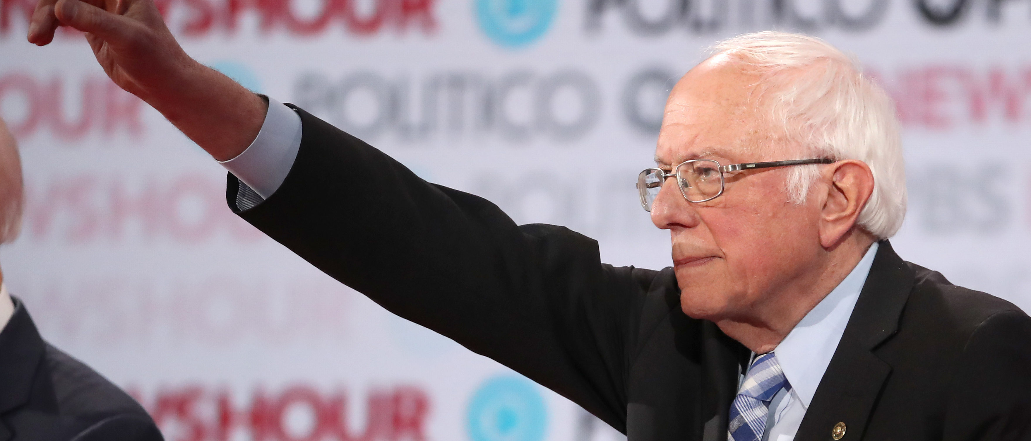 LOS ANGELES, CALIFORNIA - DECEMBER 19: Sen. Bernie Sanders (I-VT) raises his hand during the Democratic presidential primary debate at Loyola Marymount University on December 19, 2019 in Los Angeles, California. Seven candidates out of the crowded field qualified for the 6th and last Democratic presidential primary debate of 2019 hosted by PBS NewsHour and Politico. (Photo by Justin Sullivan/Getty Images)