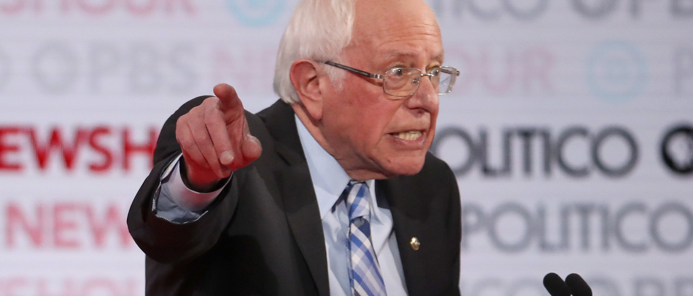 LOS ANGELES, CALIFORNIA - DECEMBER 19: Sen. Bernie Sanders (I-VT) (L) points during the Democratic presidential primary debate at Loyola Marymount University on December 19, 2019 in Los Angeles, California. Seven candidates out of the crowded field qualified for the 6th and last Democratic presidential primary debate of 2019 hosted by PBS NewsHour and Politico. (Photo by Justin Sullivan/Getty Images)