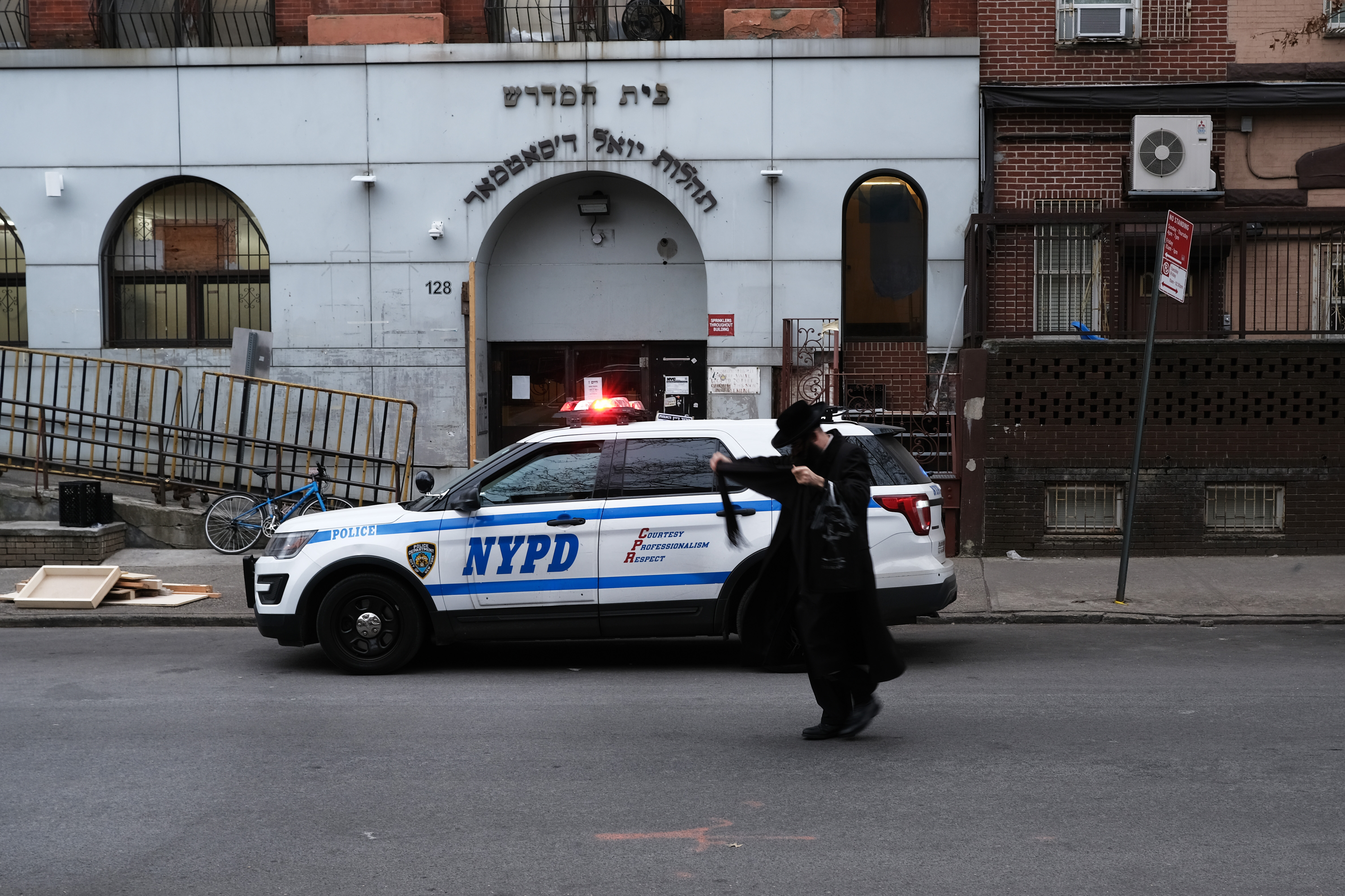 NEW YORK, NEW YORK - DECEMBER 29: A member of an Orthodox Jewish community walks through a Brooklyn neighborhood on December 29, 2019 in New York City. Five Orthodox Jews were stabbed by an intruder at a rabbi's house during a Hannukah party on Saturday evening in the upstate New York town of Monsey. Tensions remain high in Jewish communities following a series of attacks and incidents in recent weeks. (Photo by Spencer Platt/Getty Images)