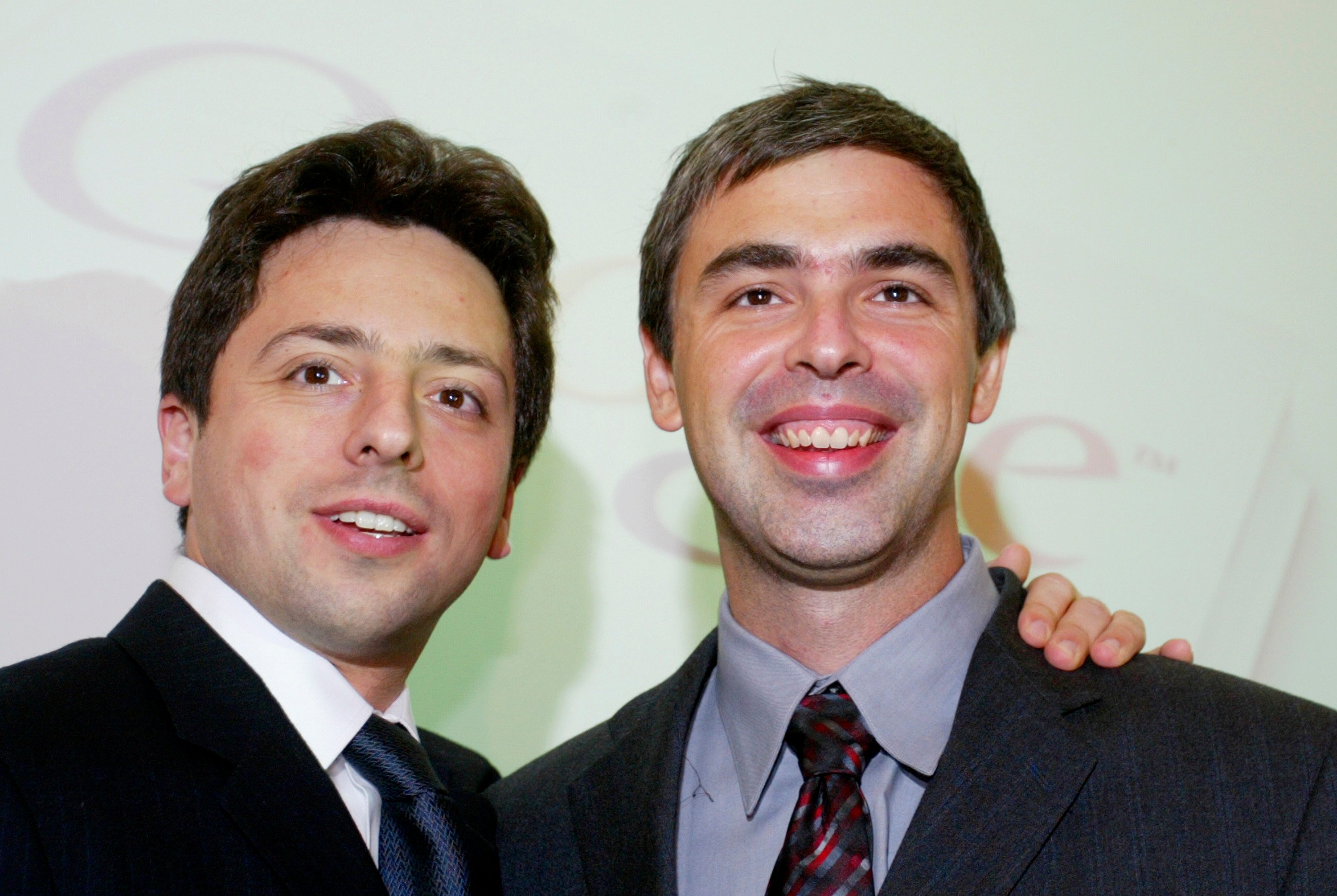 Google founders Sergey Brin (L) and Larry Page (R) smile prior to a news conference during the opening of the Frankfurt bookfair on October 7, 2004 in Frankfurt, Germany. (Ralph Orlowski/Getty Images)