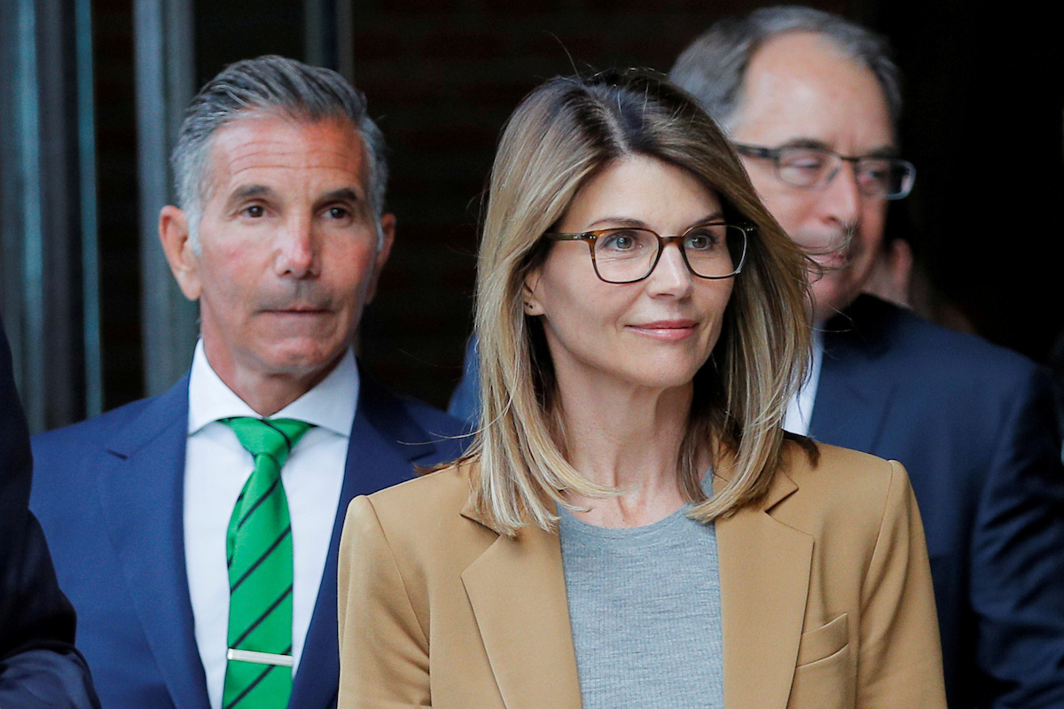 Actor Lori Loughlin, and her husband, fashion designer Mossimo Giannulli, leave the federal courthouse after facing charges in a nationwide college admissions cheating scheme, in Boston, Massachusetts, U.S., April 3, 2019. REUTERS/Brian Snyder/File Photo 