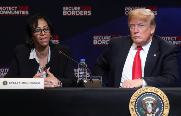 President Trump listens to Rodriguez, whose daughter was killed by gang members, during roundtable on immigration in Bethpage, New York