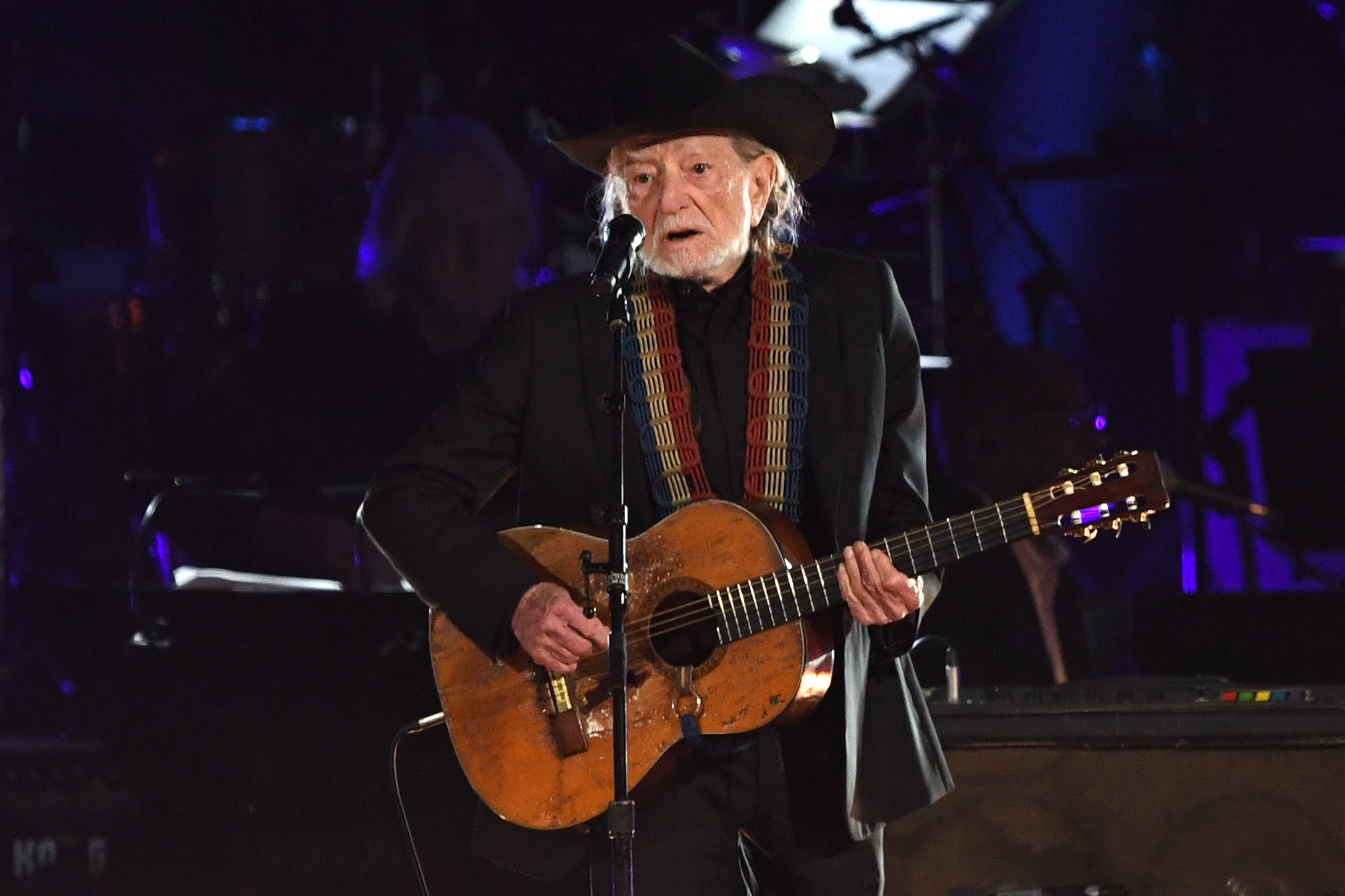 US musician Willie Nelson performs at the 2019 MusiCares Person Of The Year gala at the Los Angeles Convention Center in Los Angeles on February 8, 2019. - The 2019 MusiCares honor US singer-songwriter Dolly Parton as the Person Of The Year. (Photo credit VALERIE MACON/AFP via Getty Images)