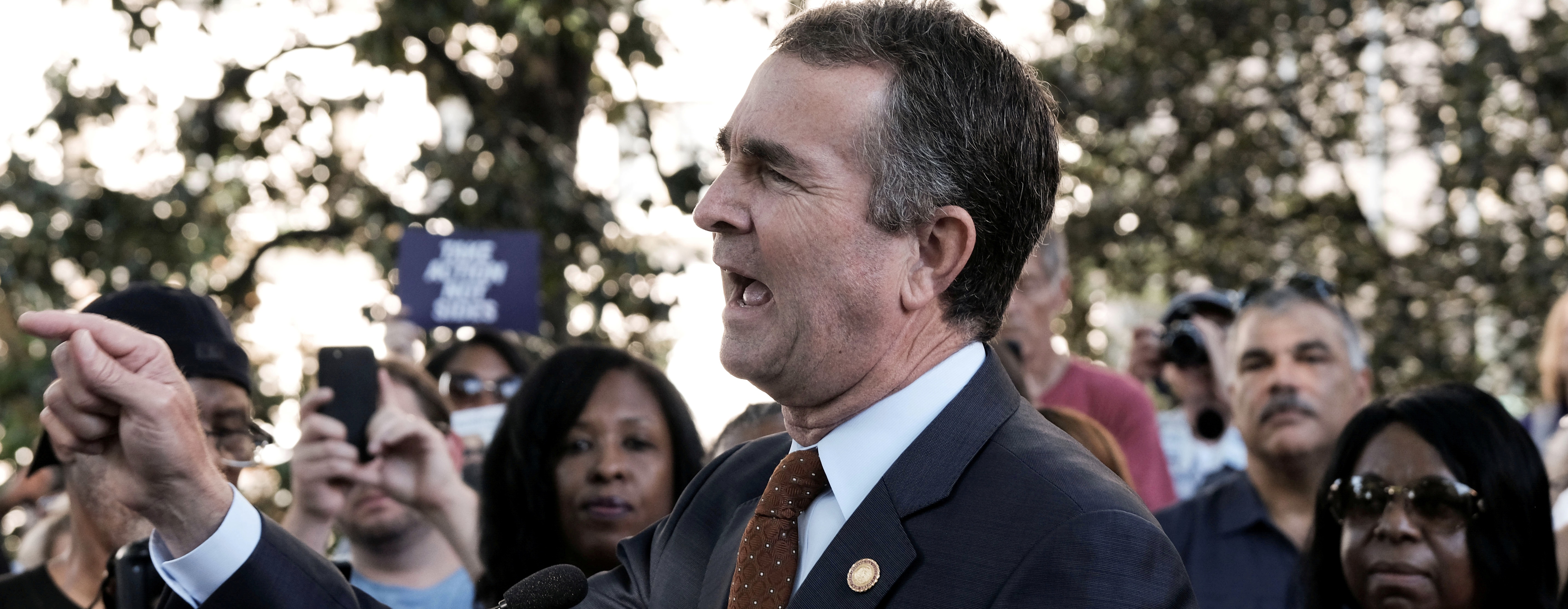 FILE PHOTO: Virginia Governor Ralph Northam speaks to gun control activists at a rally by Moms Demand Action and other family members of shooting victims outside of the Virginia State Capitol Building in Richmond, Virginia, U.S. July 9, 2019. REUTERS/Michael A. McCoy/File Photo