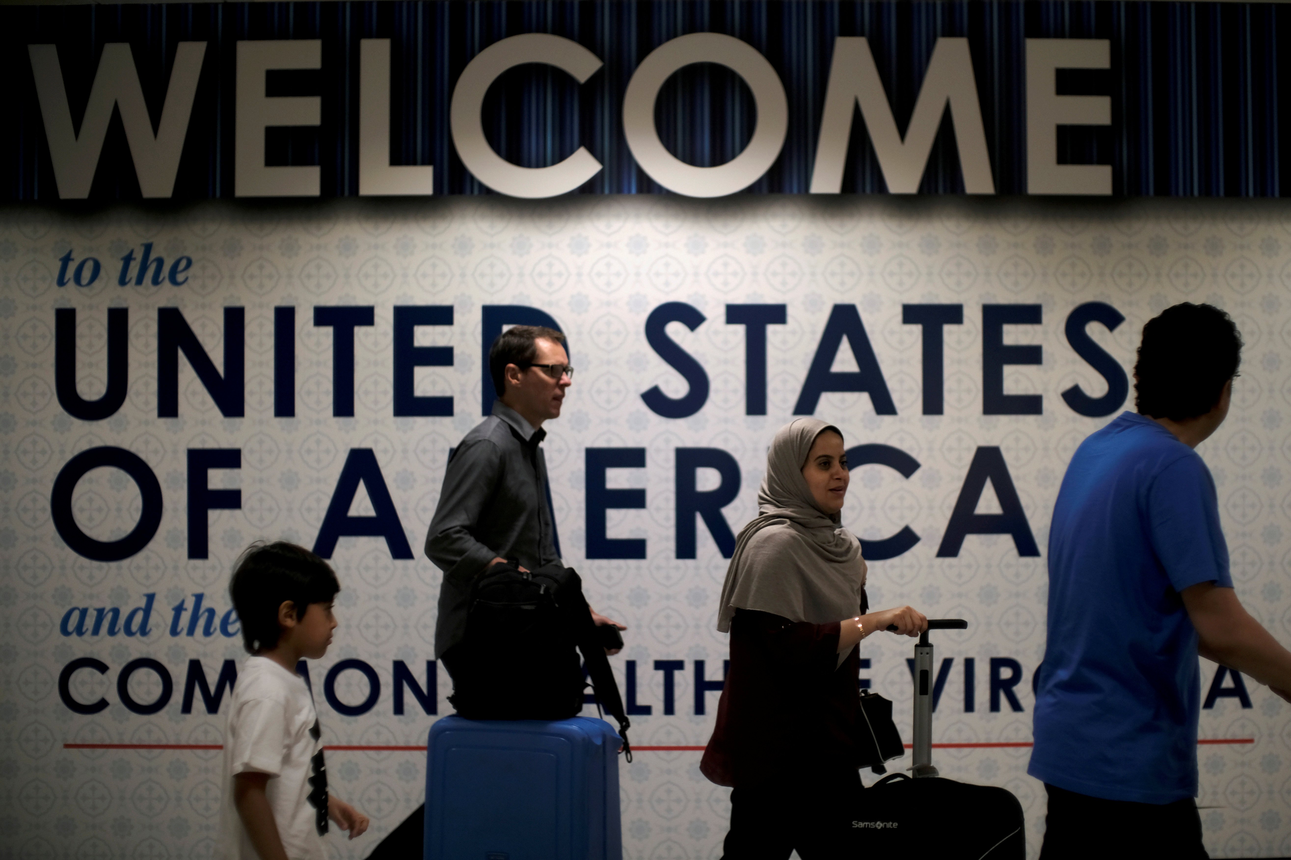 FILE PHOTO: International passengers arrive at Washington Dulles International Airport in Dulles