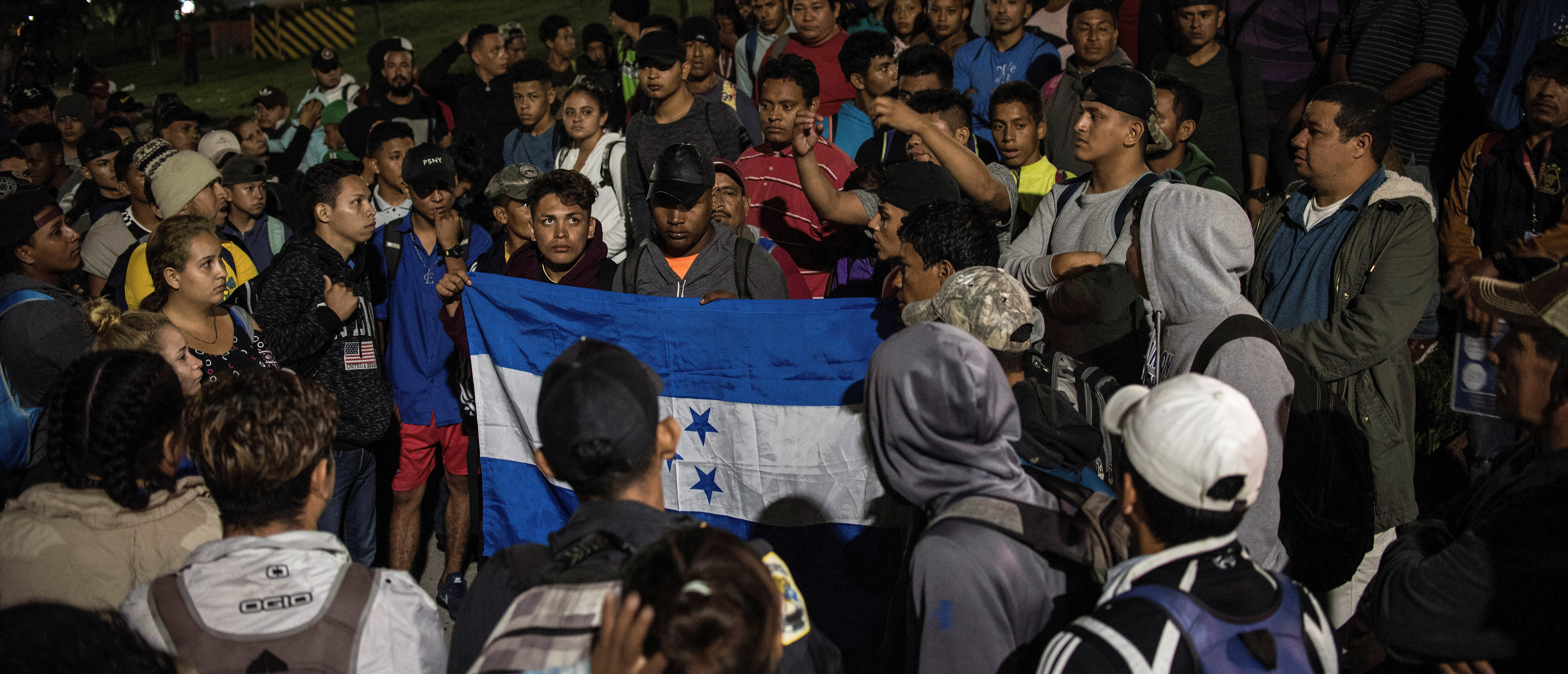 Hondurans gather to depart in a new caravan of migrants, set to head to the United States, in San Pedro Sula