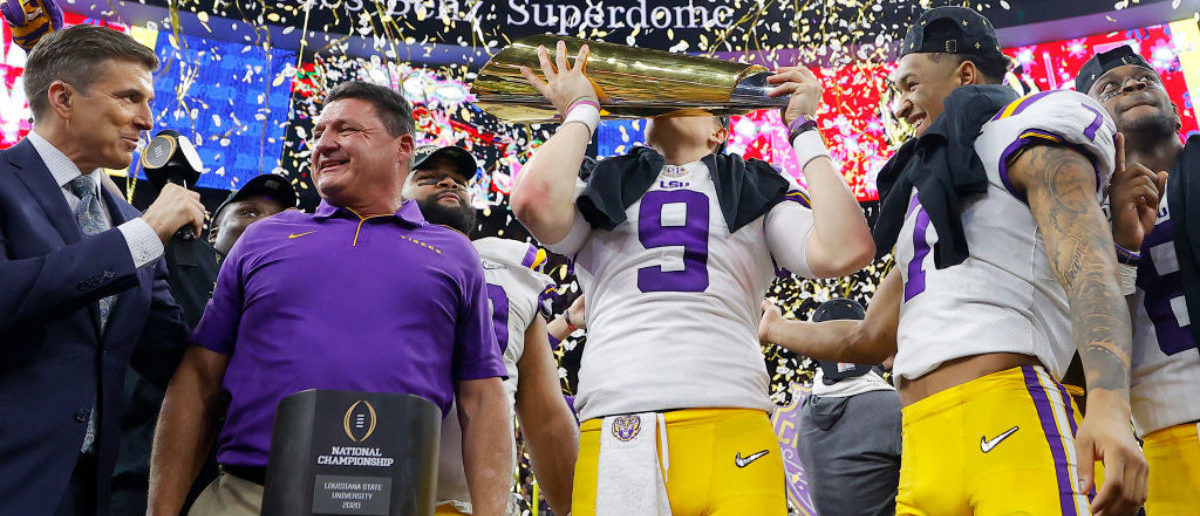 NEW ORLEANS, LOUISIANA - JANUARY 13: Head coach Ed Orgeron of the LSU Tigers, Joe Burrow #9 of the LSU Tigers and Grant Delpit #7 of the LSU Tigers celebrate with the trophy after defeating the Clemson Tigers 42-25 in the College Football Playoff National Championship game at Mercedes Benz Superdome on January 13, 2020 in New Orleans, Louisiana. (Photo by Kevin C. Cox/Getty Images)