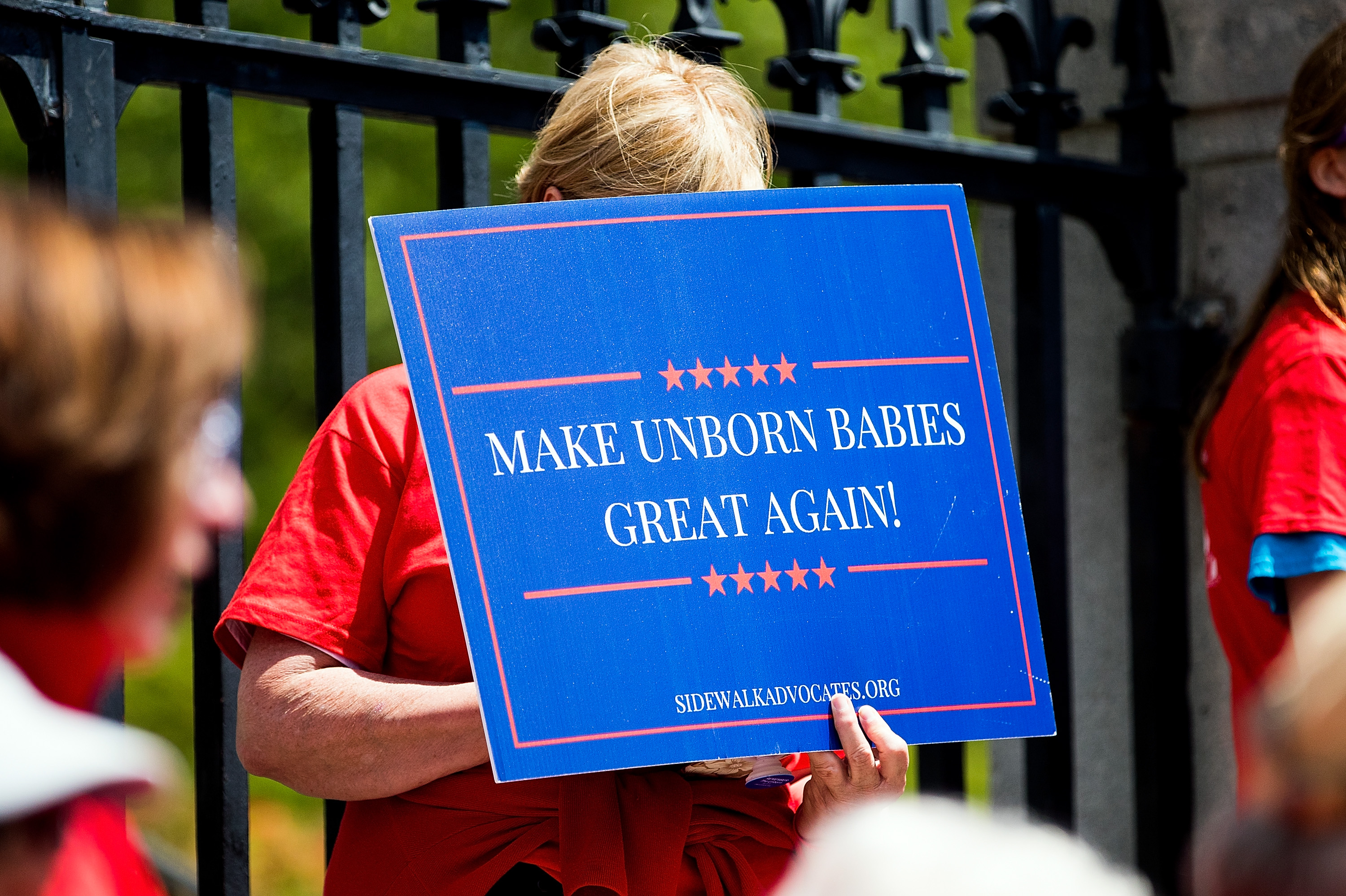 BOSTON, MA - JUNE 17: Members of Massachusetts Citizens for Life hold a rally outside the Massachusetts Statehouse on June 17, 2019 in Boston, Massachusetts. Opposing activists were rallying in advance of consideration by lawmakers of measures aimed at loosening restrictions on abortion, including removing criminal penalties for those performed after 24 weeks as well as removing the requirement for parental-consent for pregnant girls under 18. (Photo by Adam Glanzman/Getty Images)