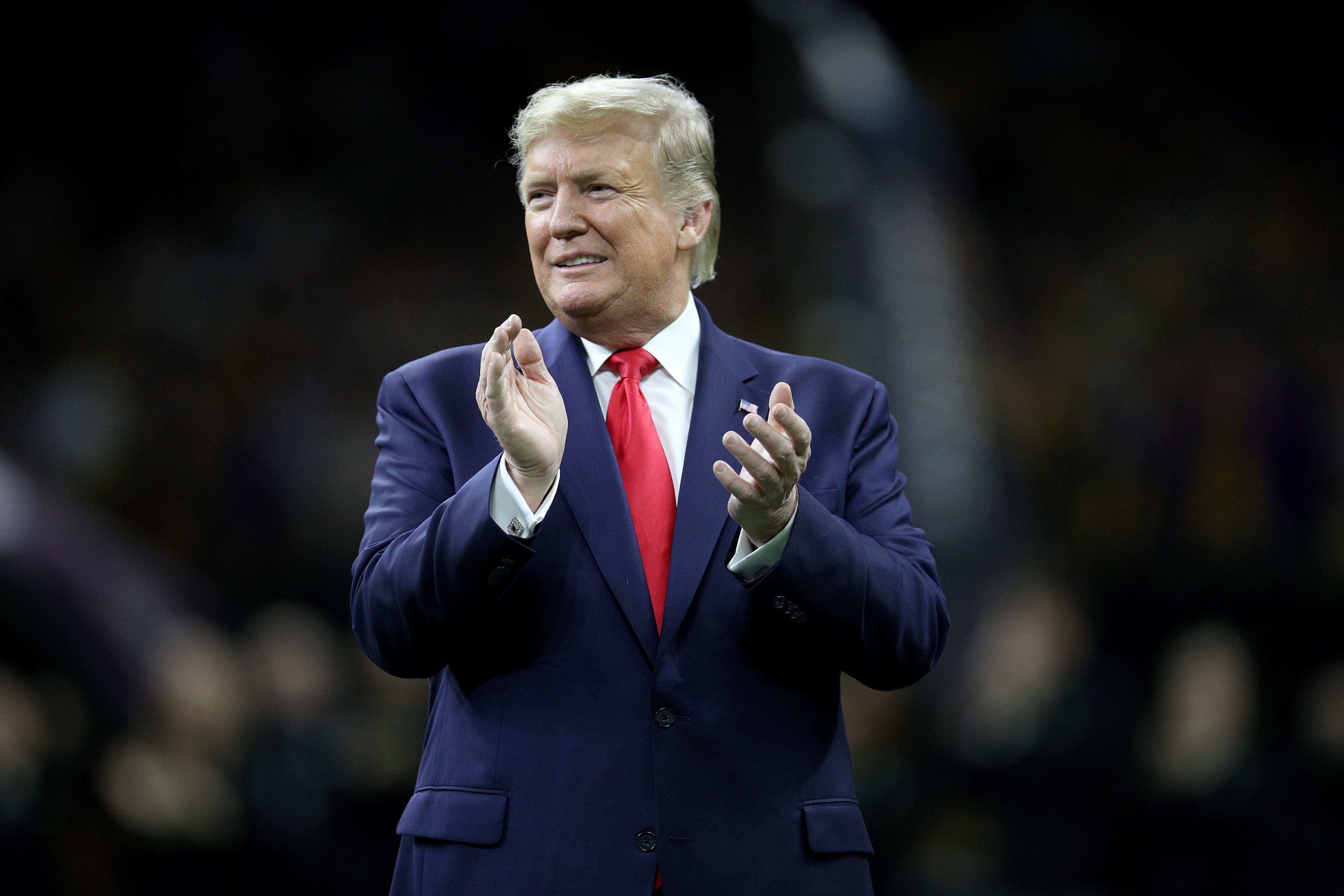 U.S. President Donald Trump claps prior to the College Football Playoff National Championship game between the Clemson Tigers and the LSU Tigers at Mercedes Benz Superdome on January 13, 2020 in New Orleans, Louisiana. (Chris Graythen/Getty Images)
