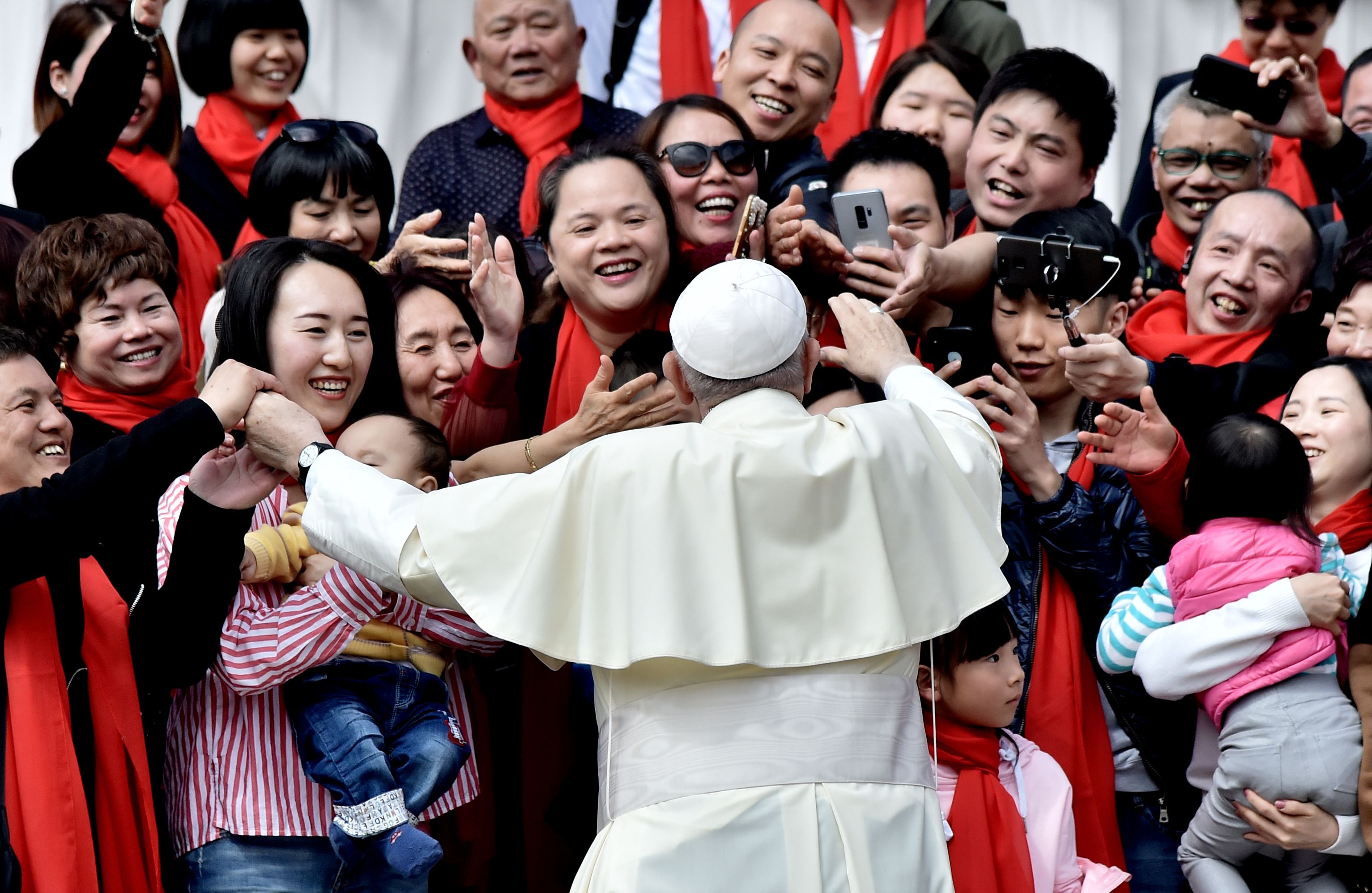 TOPSHOT - Pope Francis greets faithful from China as he arrives for his weekly general audience on April 18, 2018, on St. Peter's square in the Vatican. (Photo by TIZIANA FABI / AFP) (Photo credit should read TIZIANA FABI/AFP via Getty Images)