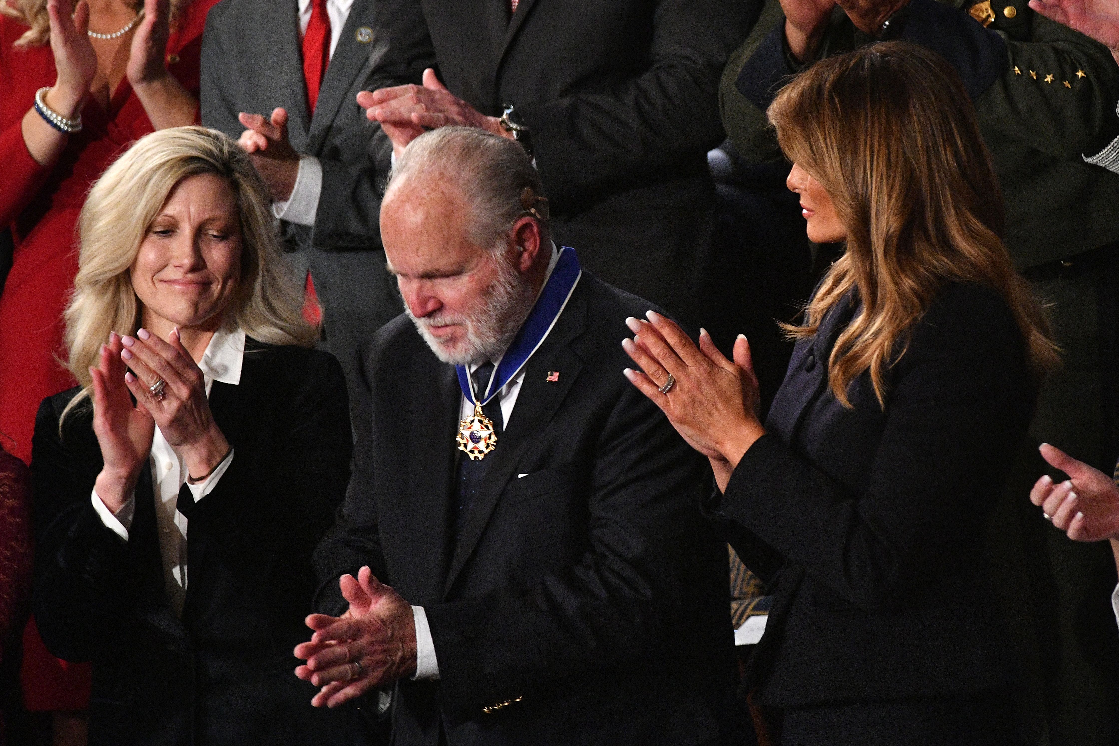 Radio personality Rush Limbaugh bows after being awarded the Medal of Freedom by First Lady Melania Trump after being acknowledged by US President Donald Trump as he delivers the State of the Union address at the US Capitol in Washington, DC, on February 4, 2020. (MANDEL NGAN/AFP via Getty Images)