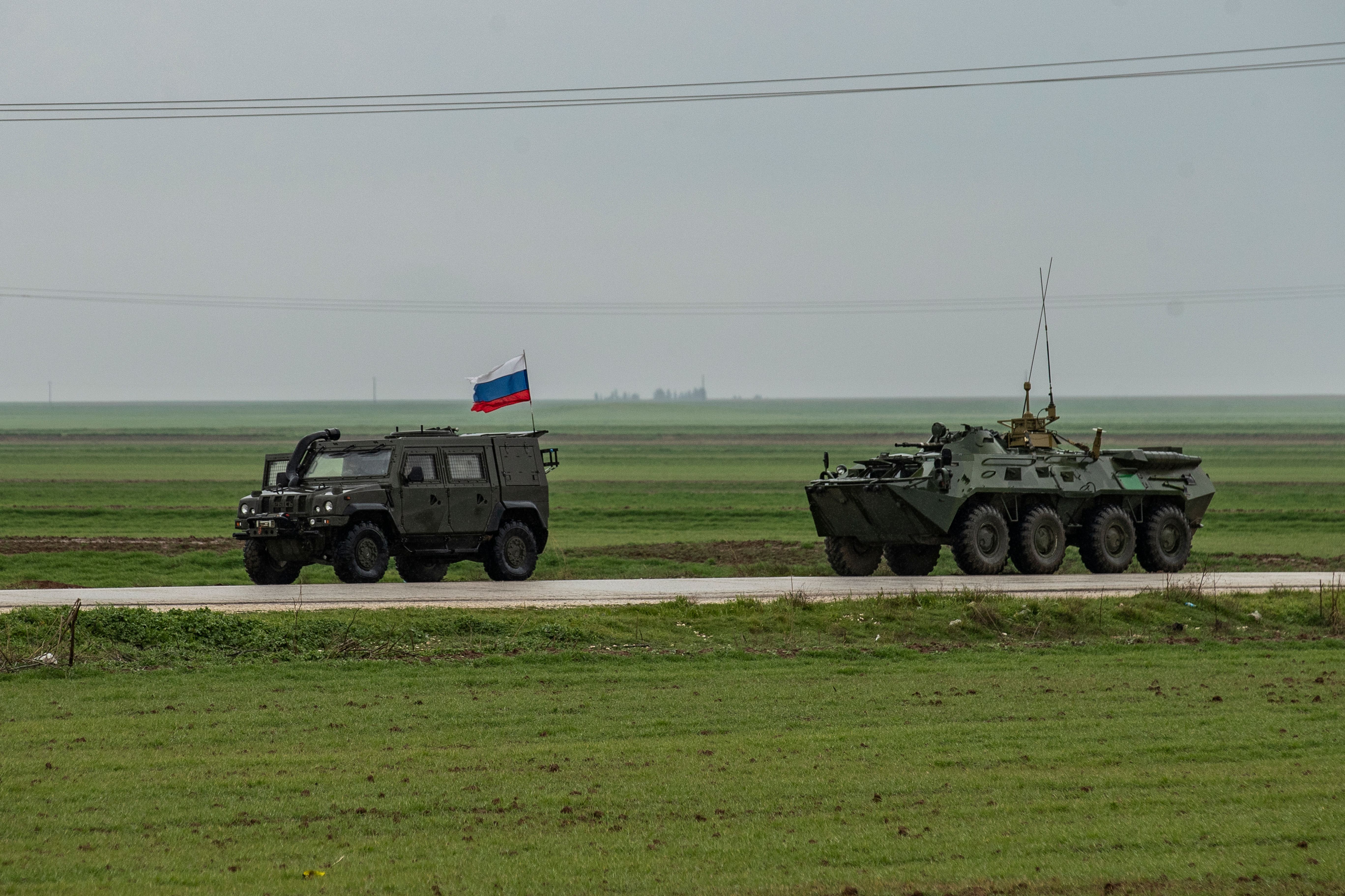 Russian military vehicles patrol the M4 highway in the northeastern Syrian Hasakeh province on the border with Turkey, on February 22, 2020. (Photo by DELIL SOULEIMAN/AFP via Getty Images)