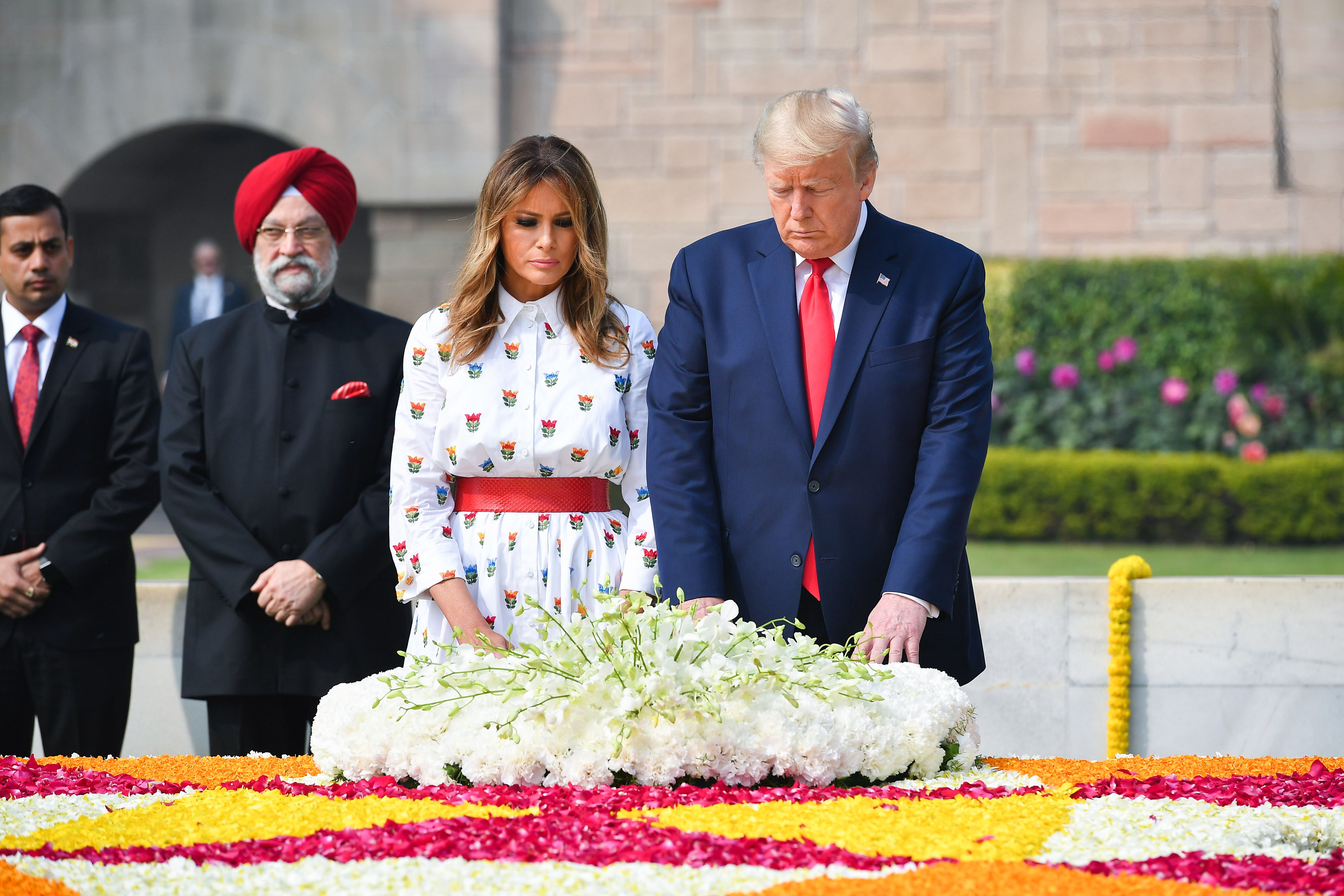 US President Donald Trump and First Lady Melania Trump lay a wreath to pay their tribute at Raj Ghat, the memorial for Indian independence icon Mahatma Gandhi, in New Delhi on February 25, 2020. (Photo by MANDEL NGAN/AFP via Getty Images)