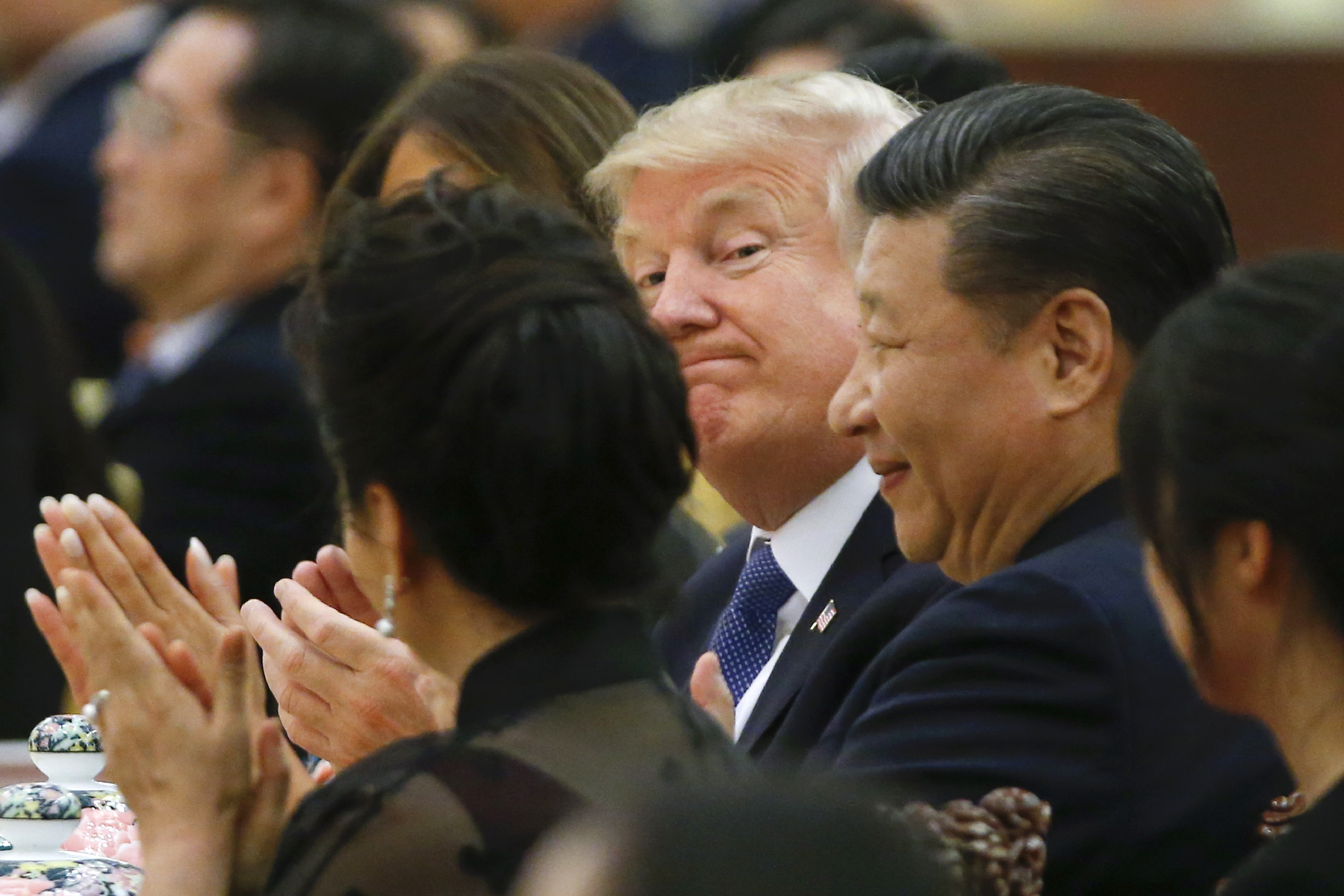 US President Donald Trump (C) and China's President Xi Jinping attend a state dinner at the Great Hall of the People in Beijing on November 9, 2017. Donald Trump urged Chinese leader Xi Jinping to work hard and act fast to help resolve the North Korean nuclear crisis during talks in Beijing Thursday, warning that "time is quickly running out". (THOMAS PETER/AFP via Getty Images)