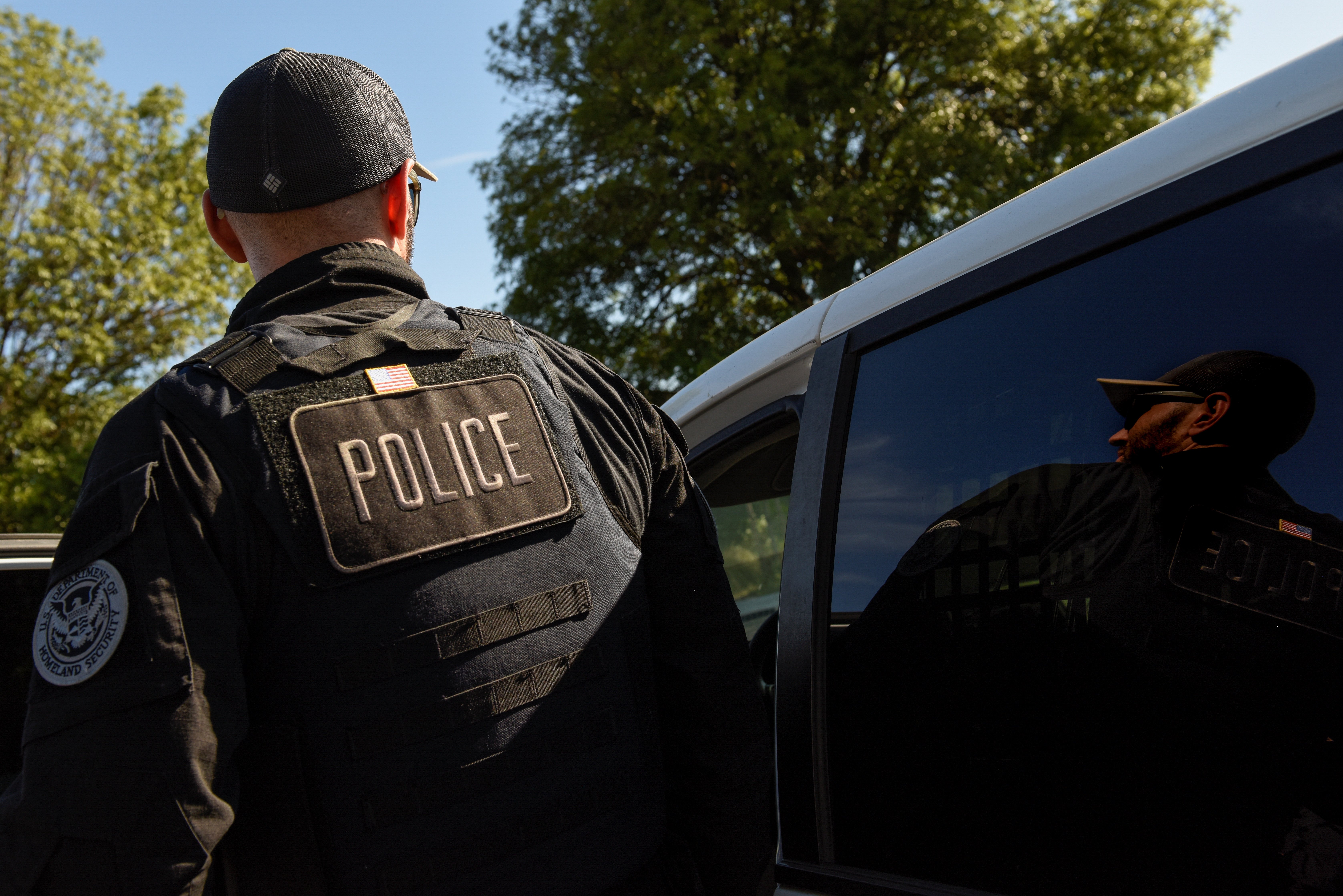 A member of ICE and ERO Fugitive Operations teams is pictured during an operation in San Jose