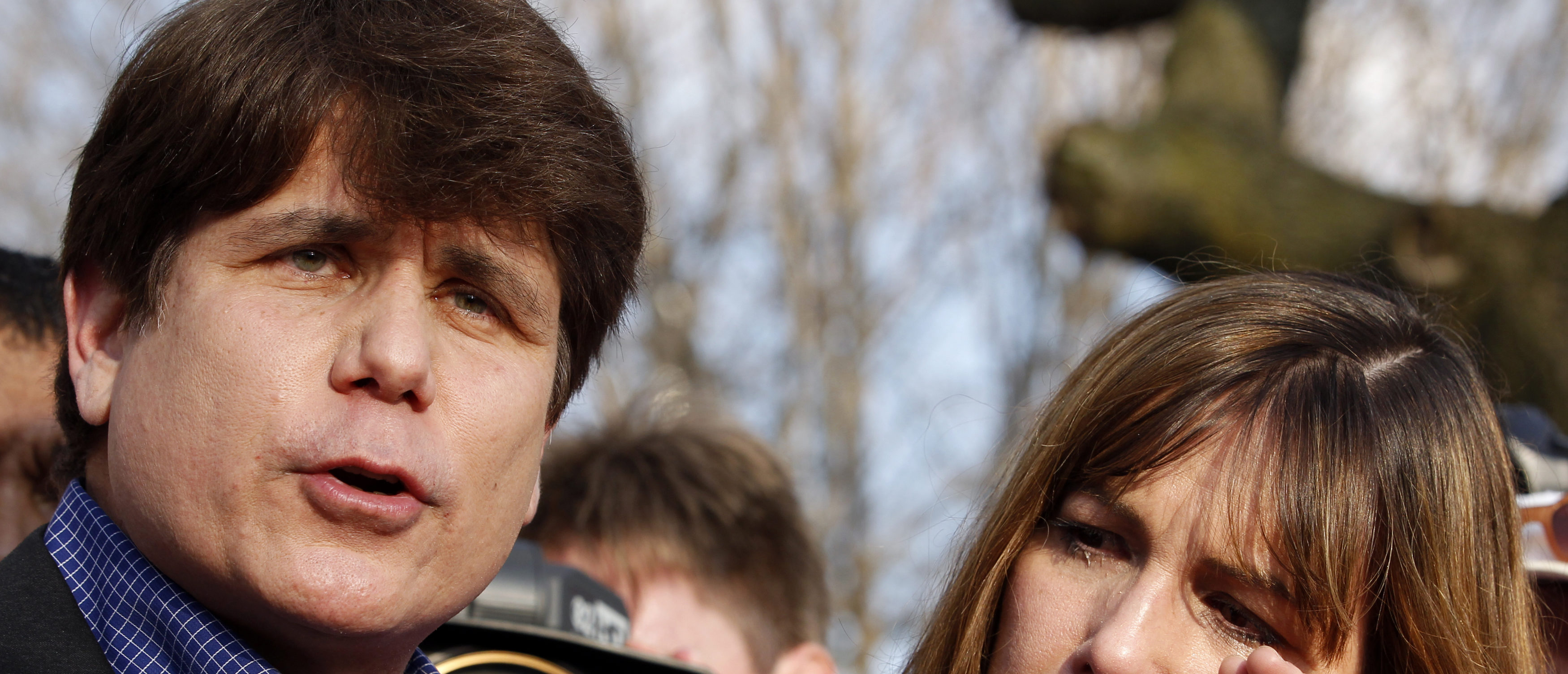 Former Governor of Illinois Rod Blagojevich, with his wife Patti, makes a statement to reporters outside his Chicago home one day before reporting to federal prison in Colorado to serve a 14-year sentence for corruption, March 14, 2012. REUTERS/Jeff Haynes