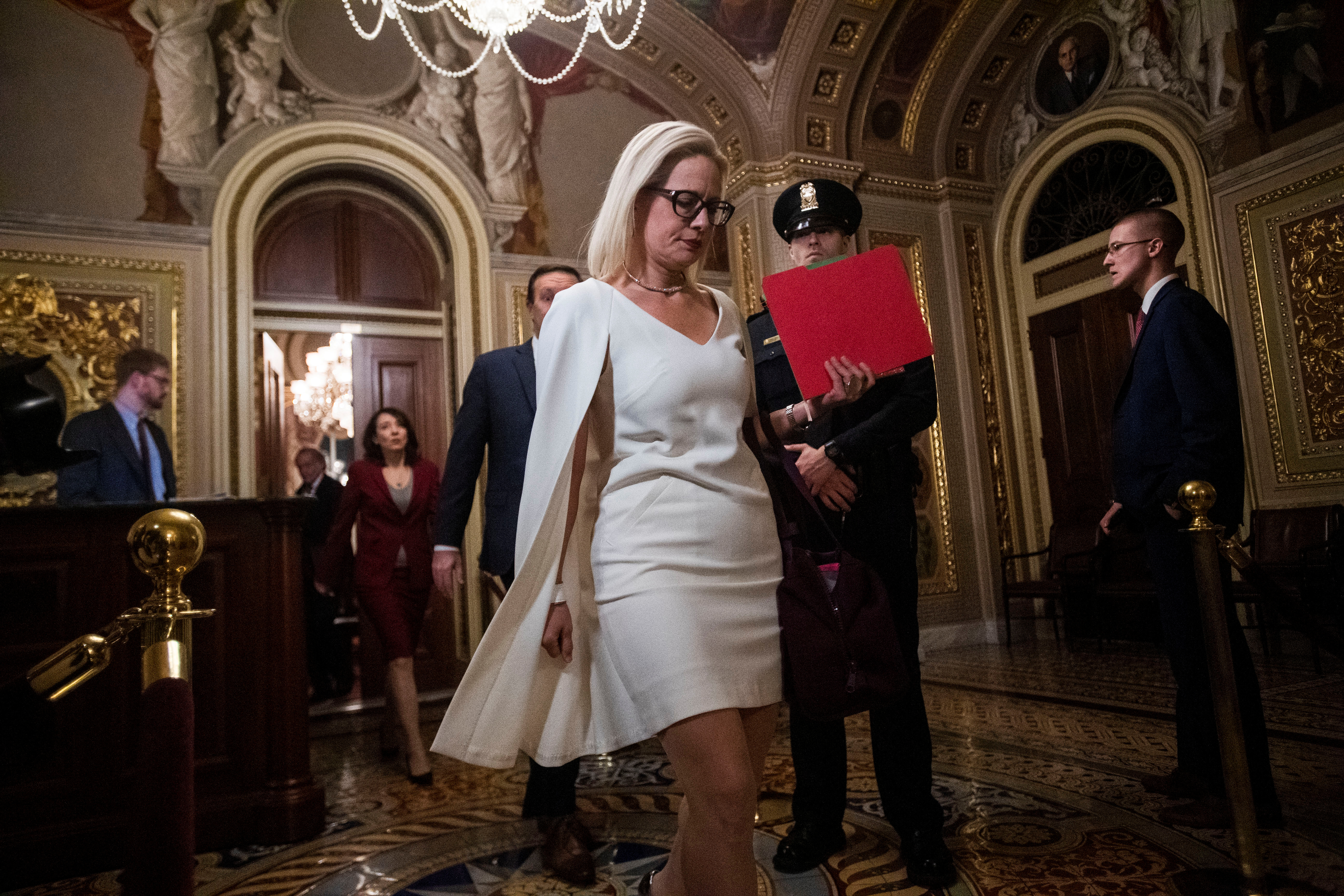 U.S. Senator Kyrsten Sinema (D-AZ) returns to the chamber following a recess at the U.S. Capitol during U.S. President Donald Trump's Senate impeachment trial in Washington, U.S., Jan. 31, 2020. REUTERS/Amanda Voisard 