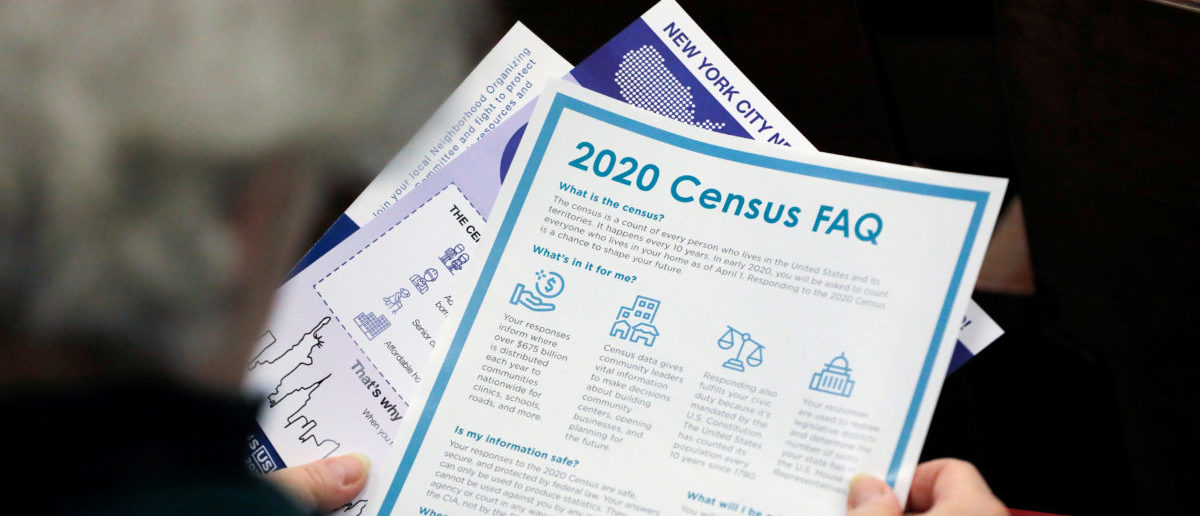 FILE PHOTO: A person holds census information at an event in Queens, New York City, U.S., February 22, 2020. [REUTERS/Andrew Kelly/File Photo]