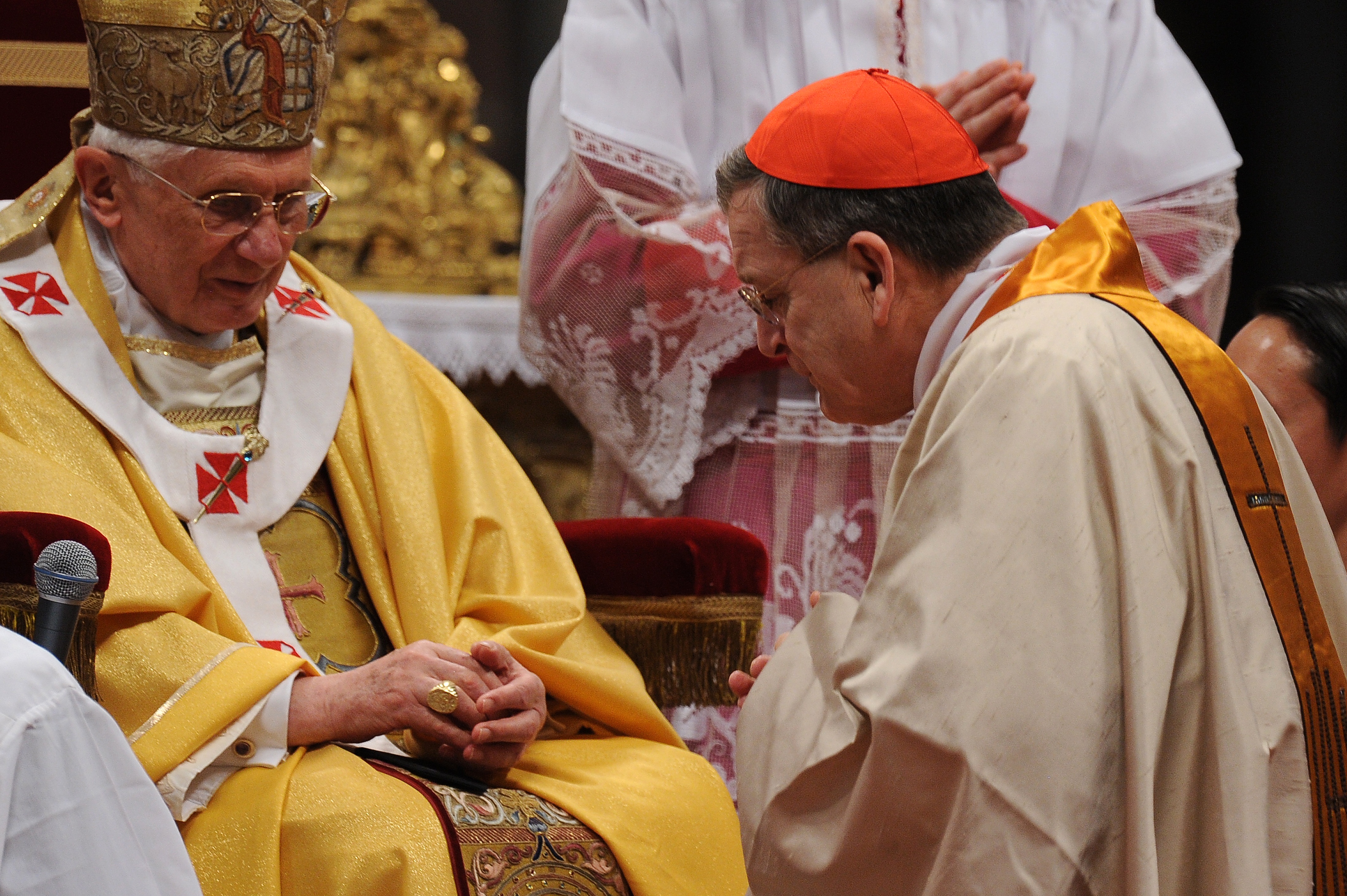 Pope Benedict XVI (L) gives his cardinal ring to US Raymond leo Burke (R) during the Eucharistic celebration with the new cardinals on November 21, 2010 at St Peter's basilica at The Vatican. 24 Roman Catholic prelates joined the day before the Vatican's College of Cardinals, the elite body that advises the pontiff and elects his successor upon his death. AFP PHOTO / ALBERTO PIZZOLI (Photo credit should read ALBERTO PIZZOLI/AFP via Getty Images)