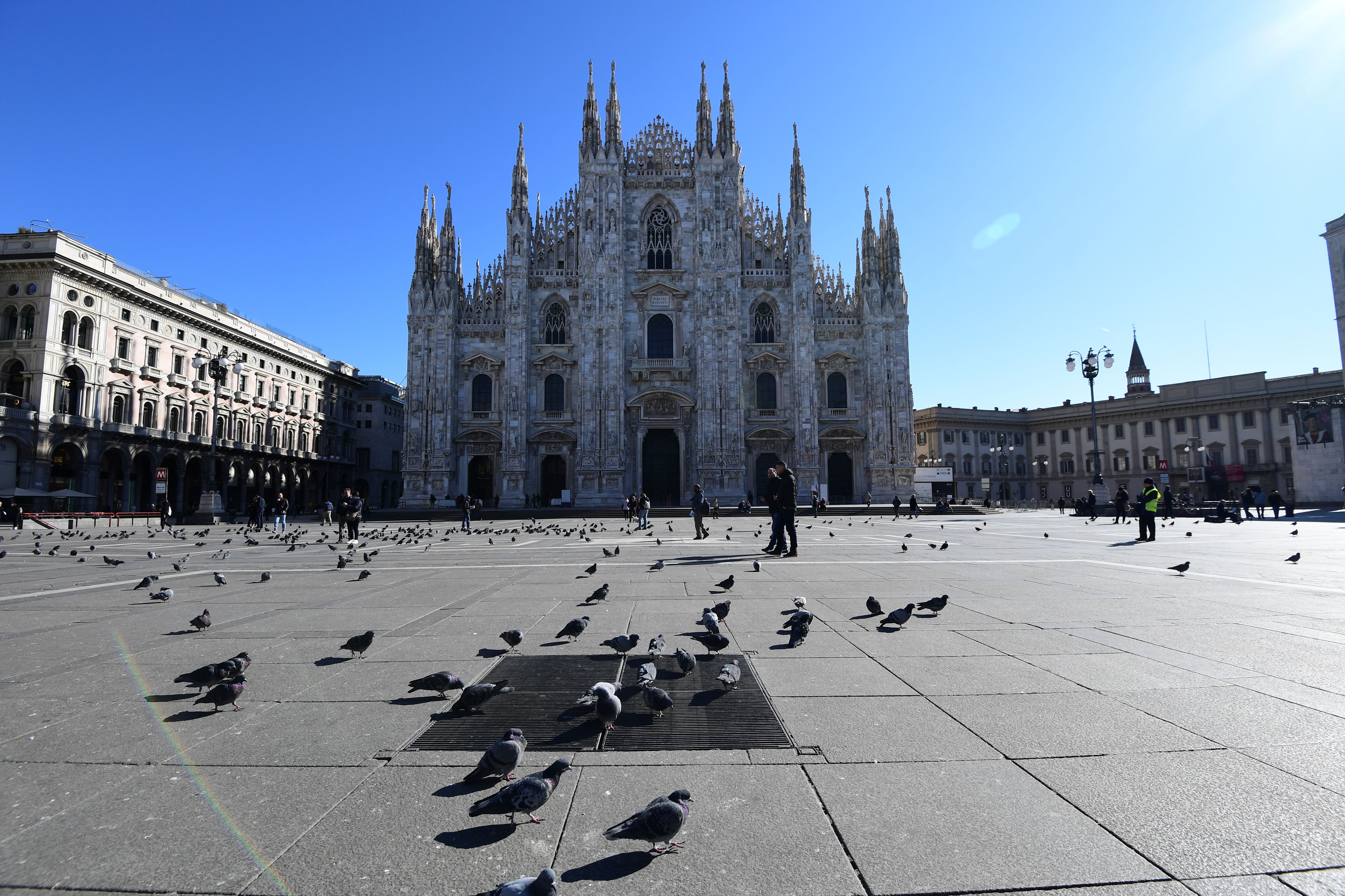 TOPSHOT - This picture taken on February 28, 2020, shows an almost empty piazza del Duomo in center Milan. - Since the Covid-19 outbreak in Italy, the epicenter of the virus in Europe, Milan is strongly hit by economic downturn, causing residents and business owners concern, AFP reports on February 29, 2020. (Photo by Miguel MEDINA / AFP) (Photo by MIGUEL MEDINA/AFP via Getty Images)