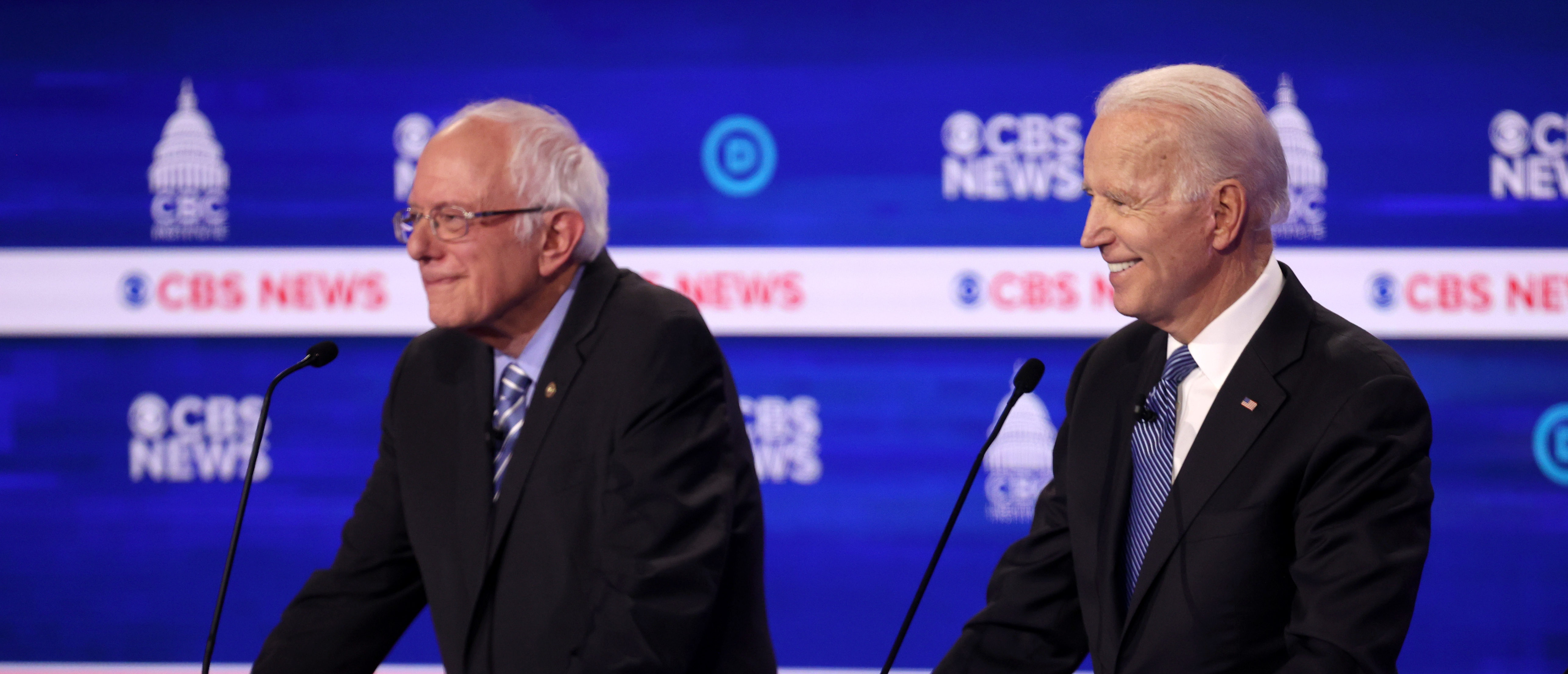 CHARLESTON, SOUTH CAROLINA - FEBRUARY 25: Democratic presidential candidate former Vice President Joe Biden smiles as Sen. Bernie Sanders (I-VT) (L) looks on during the Democratic presidential primary debate at the Charleston Gaillard Center on February 25, 2020 in Charleston, South Carolina. Seven candidates qualified for the debate, hosted by CBS News and Congressional Black Caucus Institute, ahead of South Carolina’s primary in four days. (Photo by Win McNamee/Getty Images)