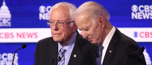 CHARLESTON, SOUTH CAROLINA - FEBRUARY 25: Democratic presidential candidates Sen. Bernie Sanders (I-VT) and former Vice President Joe Biden speak during a break at the Democratic presidential primary debate at the Charleston Gaillard Center on February 25, 2020 in Charleston, South Carolina. Seven candidates qualified for the debate, hosted by CBS News and Congressional Black Caucus Institute, ahead of South Carolina’s primary in four days. (Photo by Win McNamee/Getty Images)