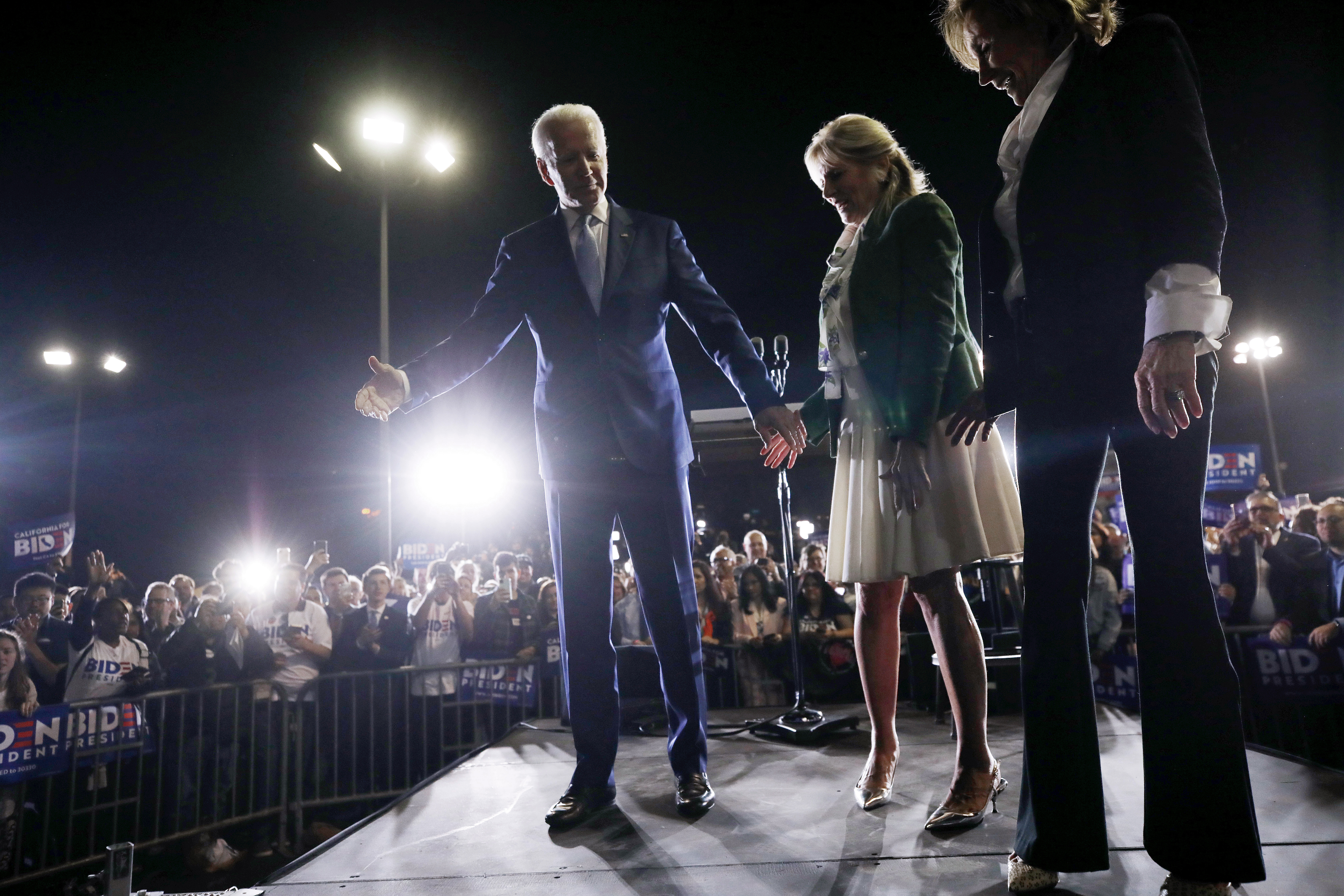 Democratic presidential candidate former Vice President Joe Biden (C) departs the stage with wife Jill (2nd R) and sister Valerie (R) at a Super Tuesday campaign event at Baldwin Hills Recreation Center on March 3, 2020 in Los Angeles, California. (Mario Tama/Getty Images)