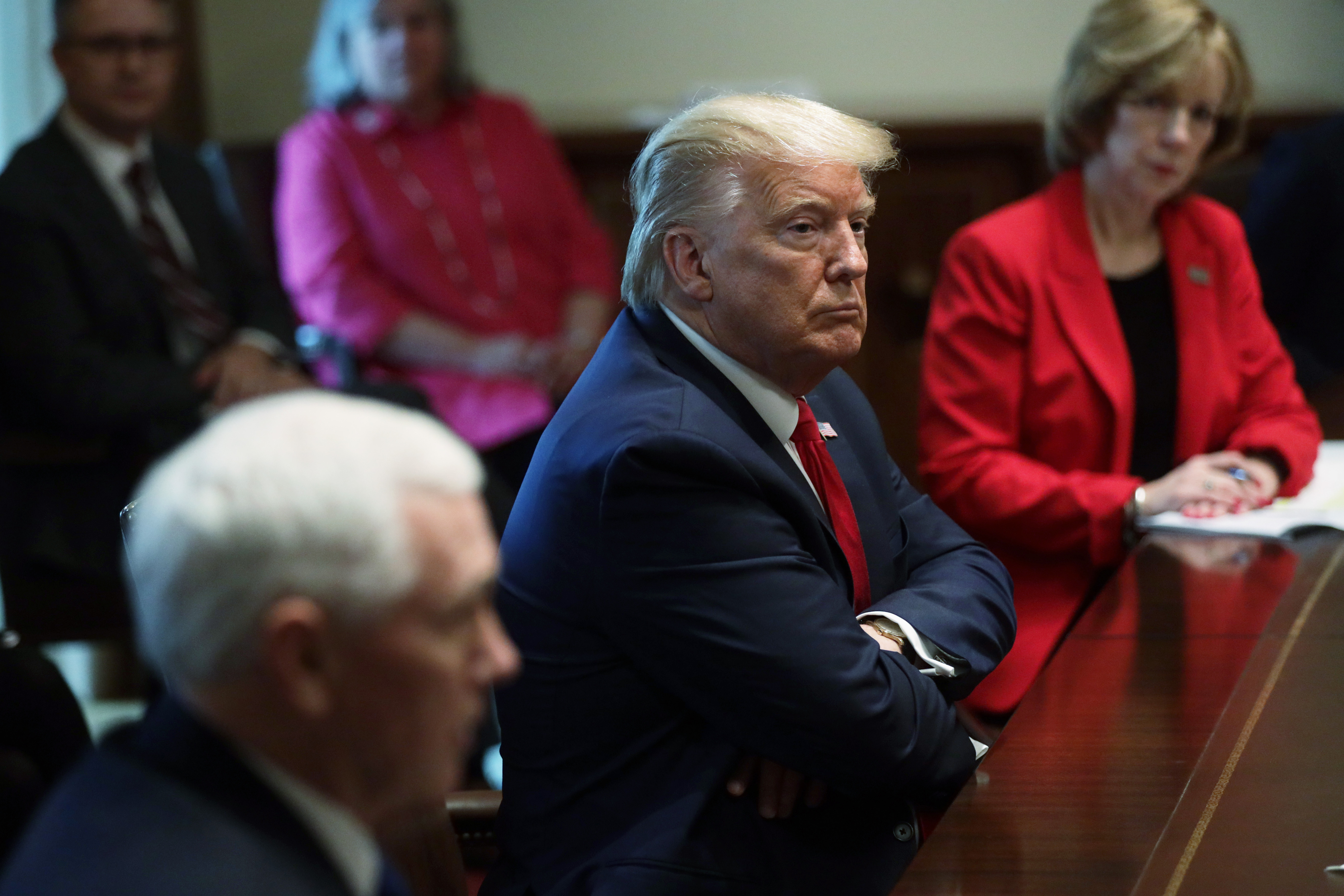 WASHINGTON, DC - MARCH 18: U.S. President Donald Trump listens during a meeting with representatives of American nurses at the Cabinet Room of the White House March 18, 2020 in Washington, DC. President Trump discussed with nurse representatives on combatting the COVID-19 pandemic. (Photo by Alex Wong/Getty Images)