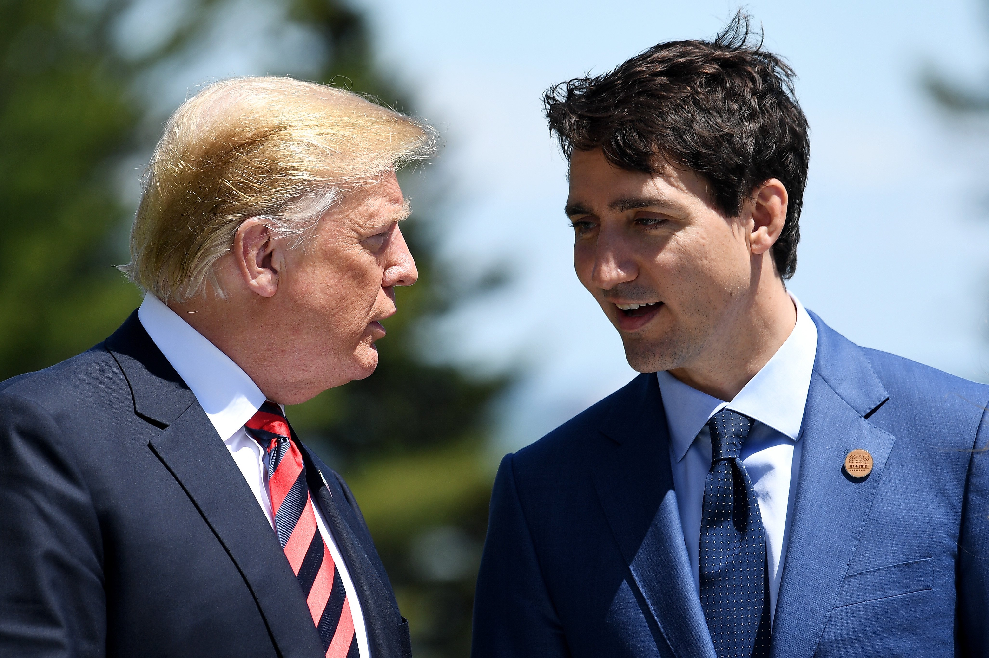 QUEBEC CITY, QC - JUNE 08: Prime Minister of Canada Justin Trudeau (R) speaks with U.S. President Donald Trump during the G7 official welcome at Le Manoir Richelieu on day one of the G7 meeting on June 8, 2018 in Quebec City, Canada. Canada will host the leaders of the UK, Italy, the US, France, Germany and Japan for the two day summit, in the town of La Malbaie. (Photo by Leon Neal/Getty Images)