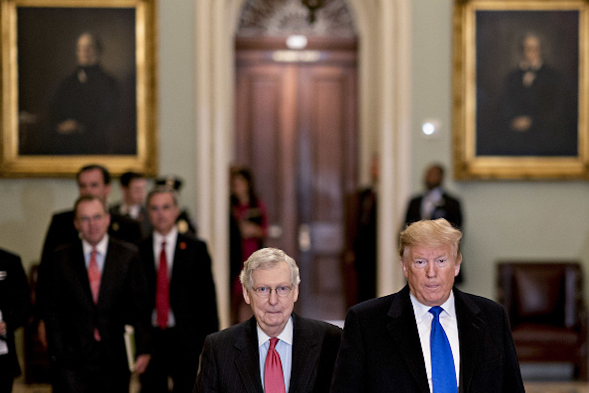 U.S. President Donald Trump, right, arrives for a Senate Republican policy luncheon with Senate Majority Leader Mitch McConnell, a Republican from Kentucky, at the U.S. Capitol in Washington, D.C., U.S., on Tuesday, March 26, 2019. Trump last week intended to reverse sanctions imposed on two Chinese shipping companies accused of violating North Korea trade prohibitions, until officials in his administration persuaded him to back off and then devised a misleading explanation of his vague tweet announcing the move. Photographer: Andrew Harrer/Bloomberg via Getty Images